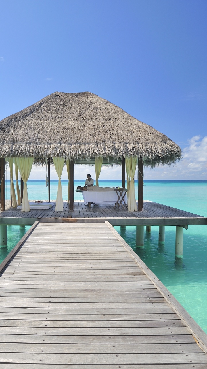 Brown Wooden Dock on Blue Sea Under Blue Sky During Daytime. Wallpaper in 720x1280 Resolution