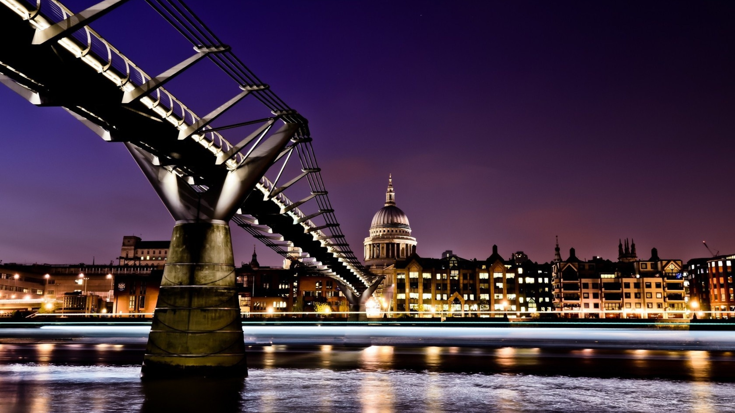 Lighted Bridge Over River During Night Time. Wallpaper in 2560x1440 Resolution