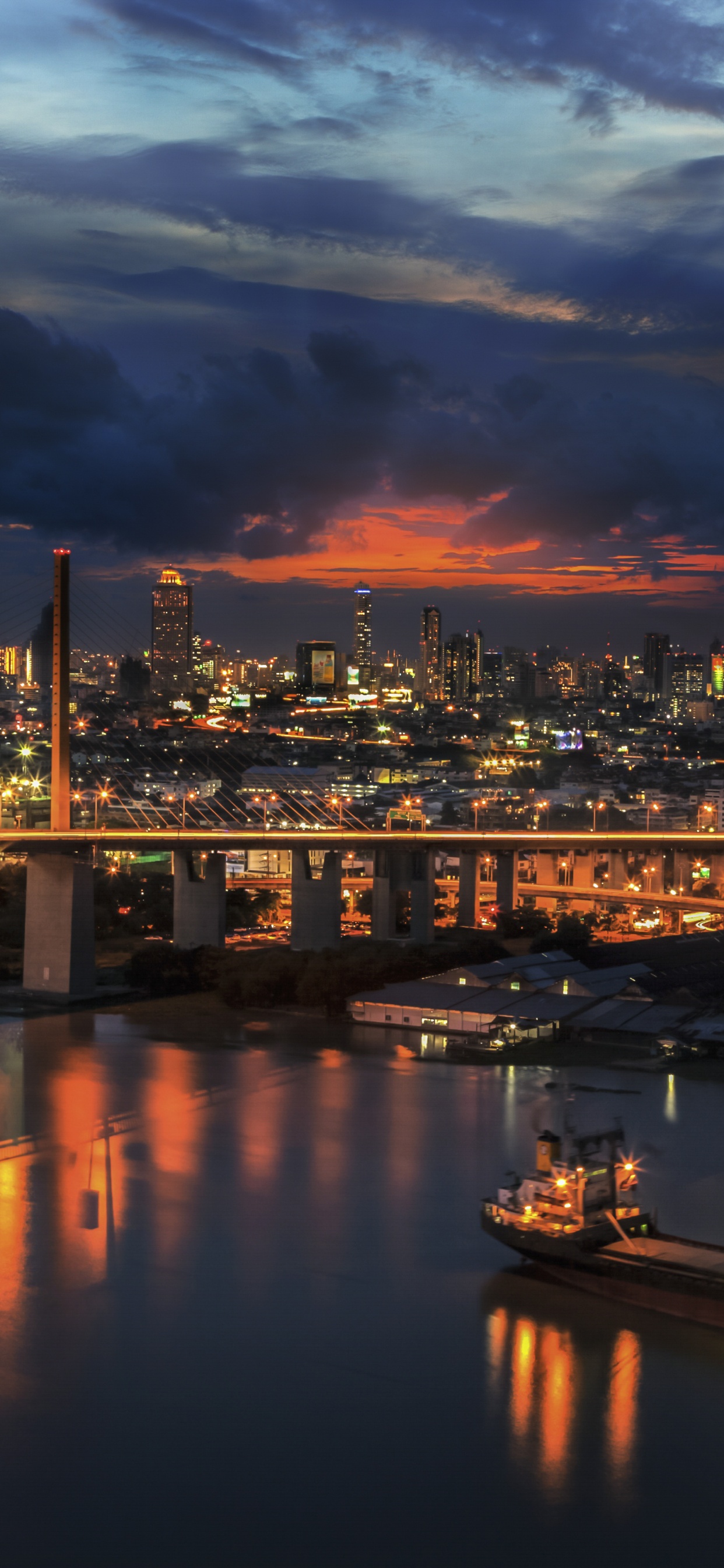 Horizon de la Ville Pendant la Nuit. Wallpaper in 1242x2688 Resolution