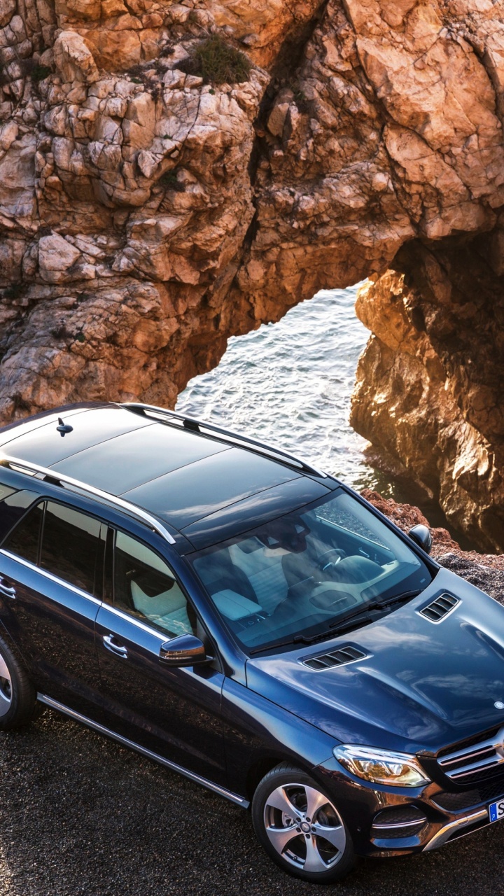Black Mercedes Benz c Class Parked on Brown Rocky Shore During Daytime. Wallpaper in 720x1280 Resolution