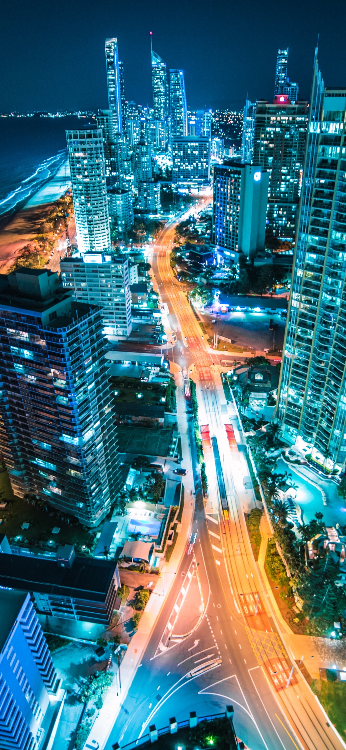 City Skyline During Night Time. Wallpaper in 1125x2436 Resolution