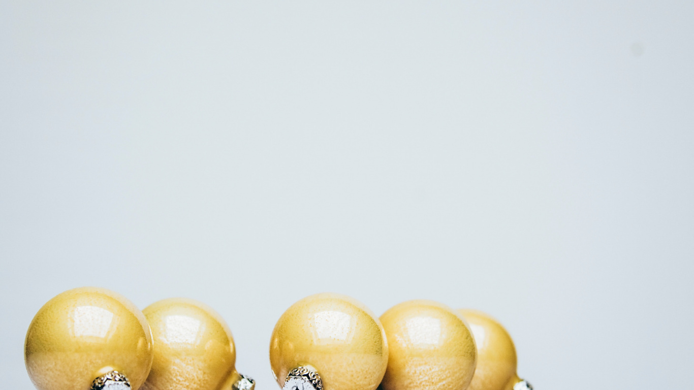 Yellow and White Beaded Accessory. Wallpaper in 1366x768 Resolution