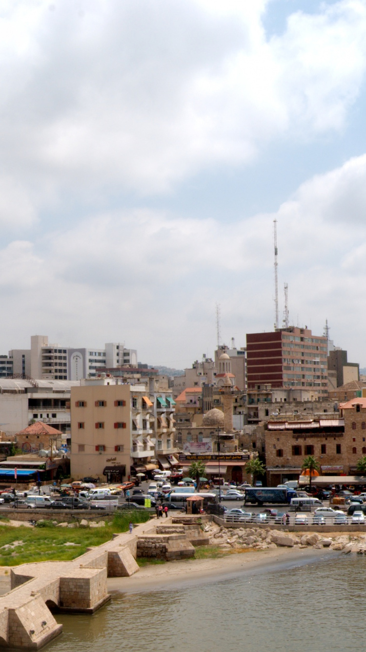 City Buildings Near River Under White Cloudy Sky During Daytime. Wallpaper in 750x1334 Resolution