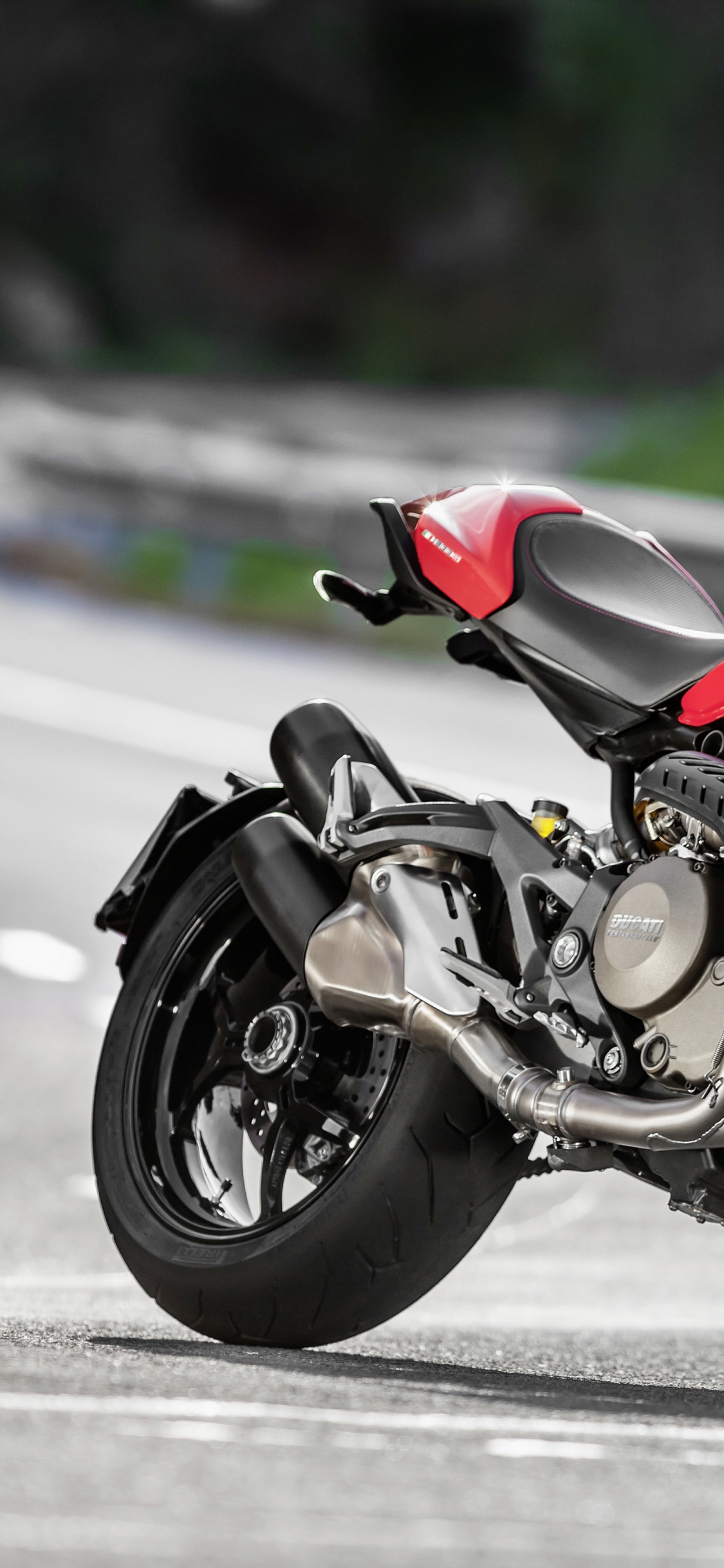 Red and Black Sports Bike on Road During Daytime. Wallpaper in 1125x2436 Resolution