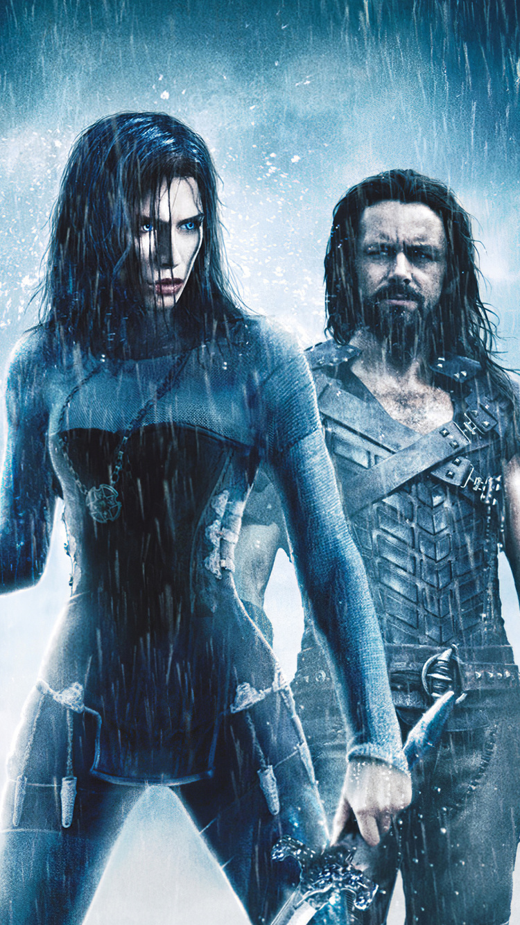 Woman in Black Tube Dress Holding Black and Brown Stick Painting. Wallpaper in 750x1334 Resolution