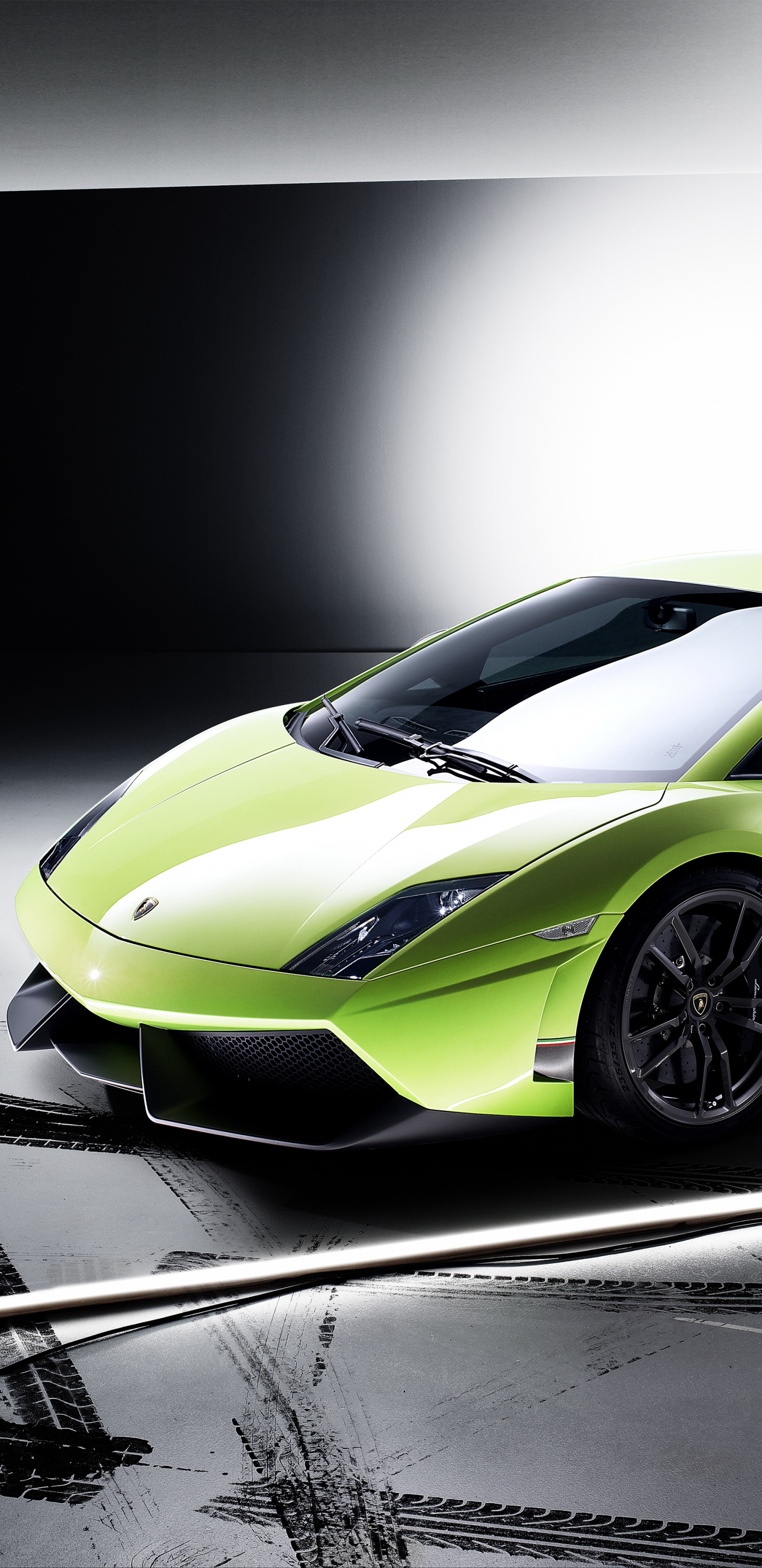 Green Lamborghini Aventador on Gray Pavement. Wallpaper in 1440x2960 Resolution