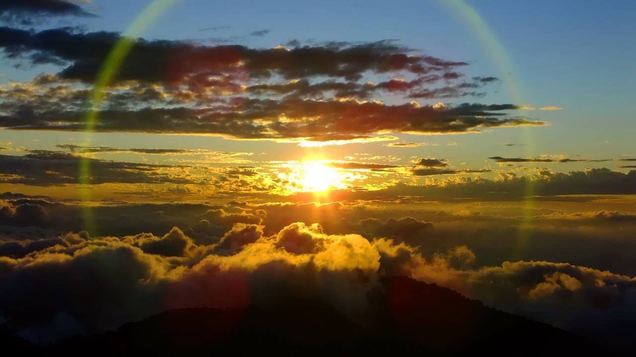 Sun Setting Over The Clouds. Wallpaper in 1280x720 Resolution