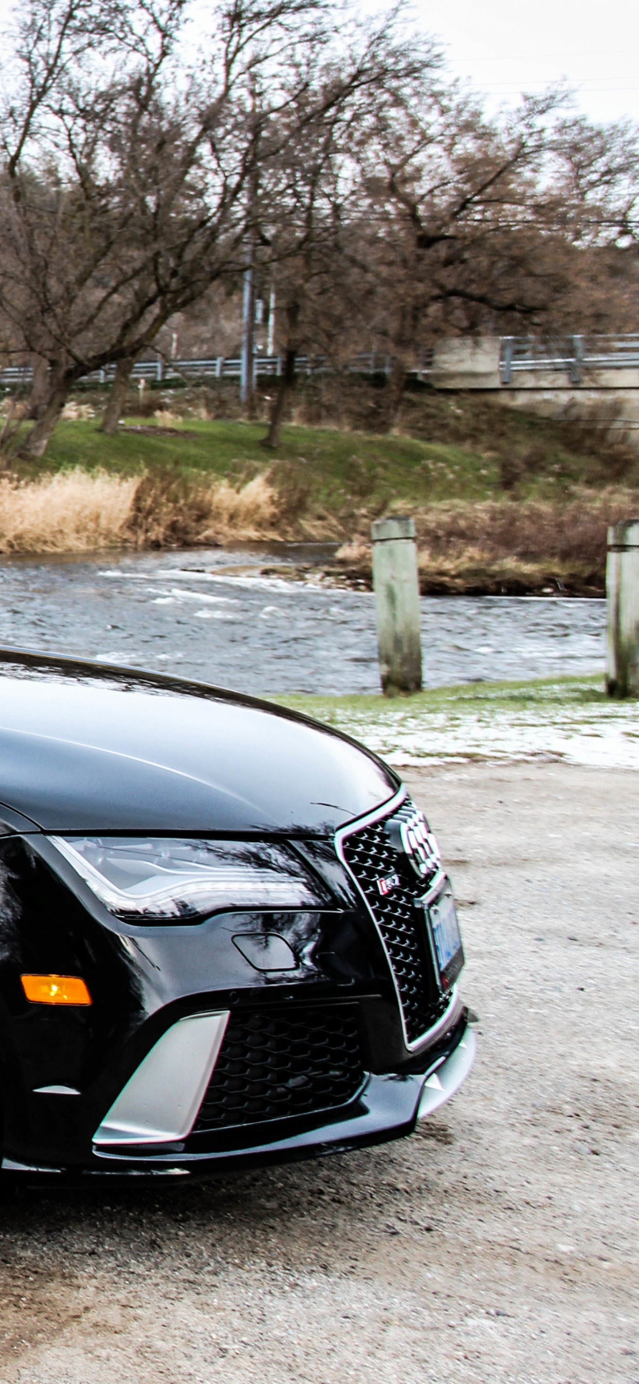 Black Sedan Parked on Gray Concrete Road During Daytime. Wallpaper in 1242x2688 Resolution