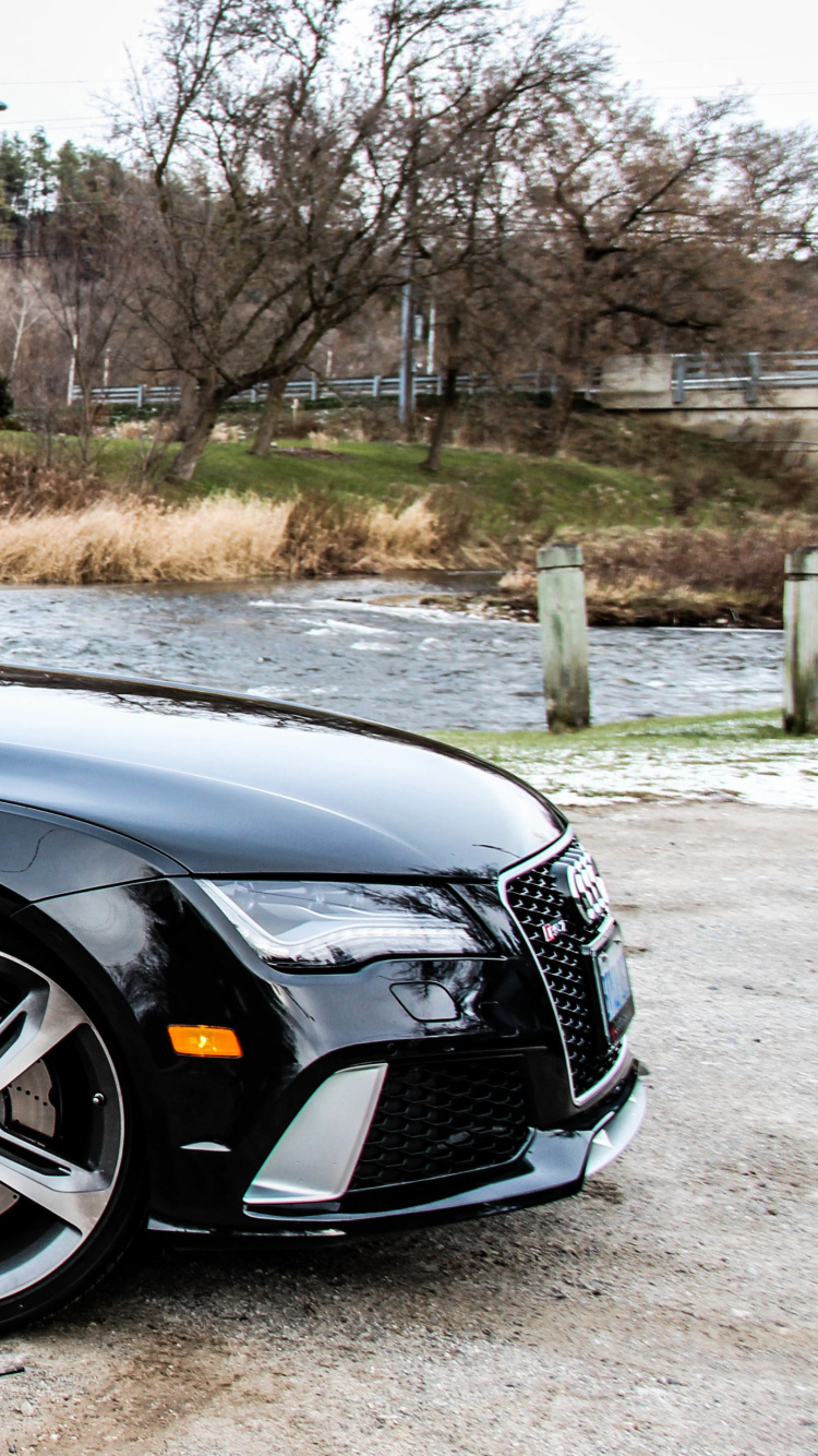 Black Sedan Parked on Gray Concrete Road During Daytime. Wallpaper in 750x1334 Resolution