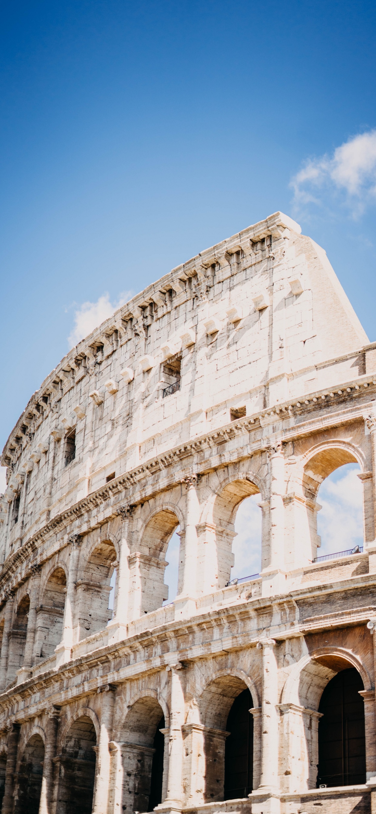 White Concrete Building Under Blue Sky During Daytime. Wallpaper in 1242x2688 Resolution