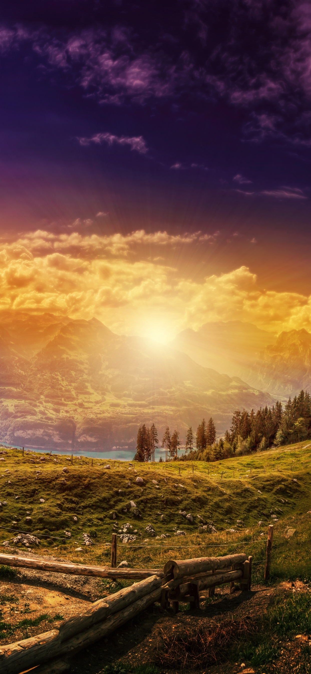 Brown Wooden Bench on Green Grass Field Near Mountains During Sunset. Wallpaper in 1242x2688 Resolution