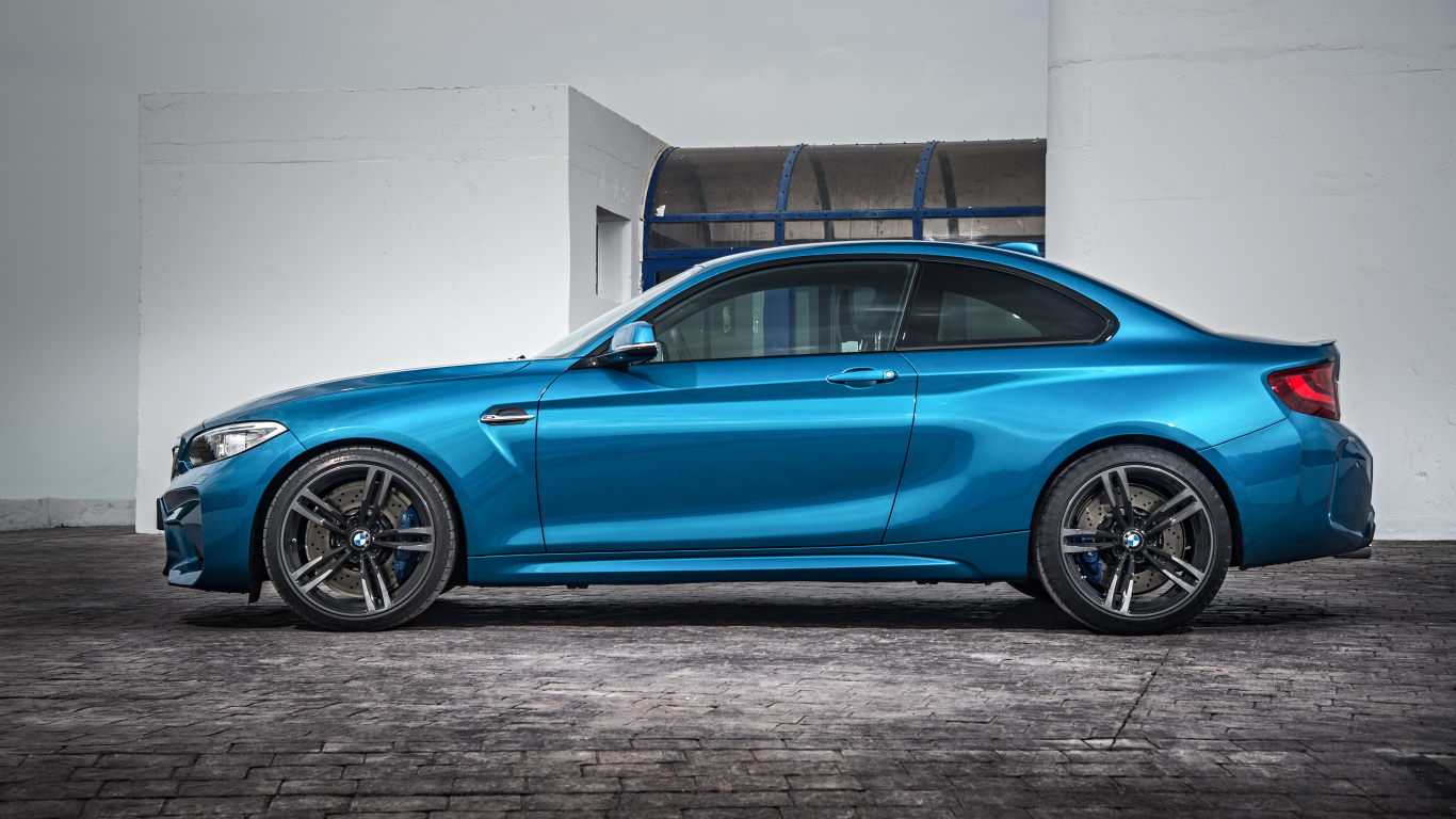 Blue Sedan Parked Beside White Wall. Wallpaper in 1366x768 Resolution