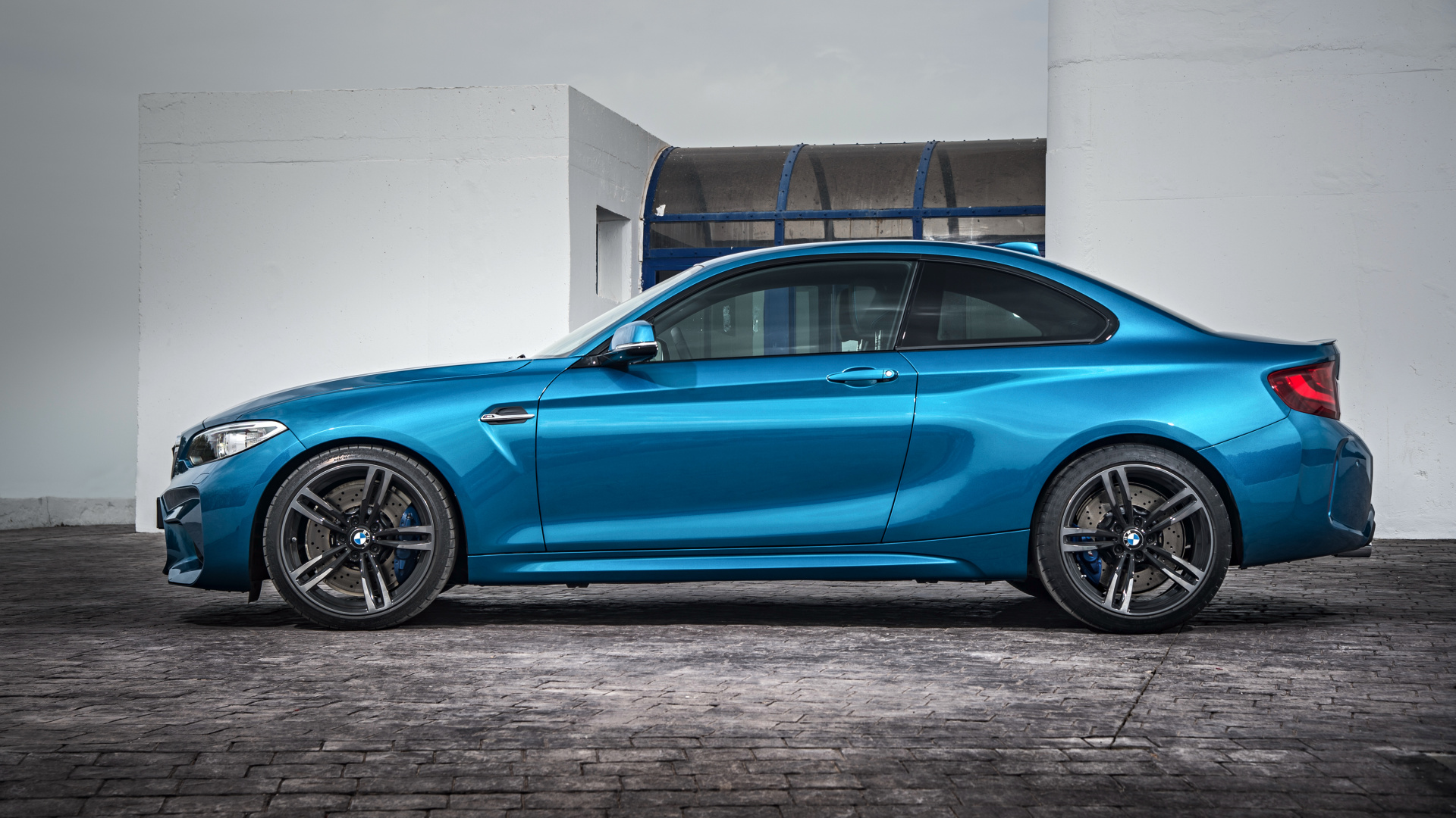 Blue Sedan Parked Beside White Wall. Wallpaper in 1920x1080 Resolution