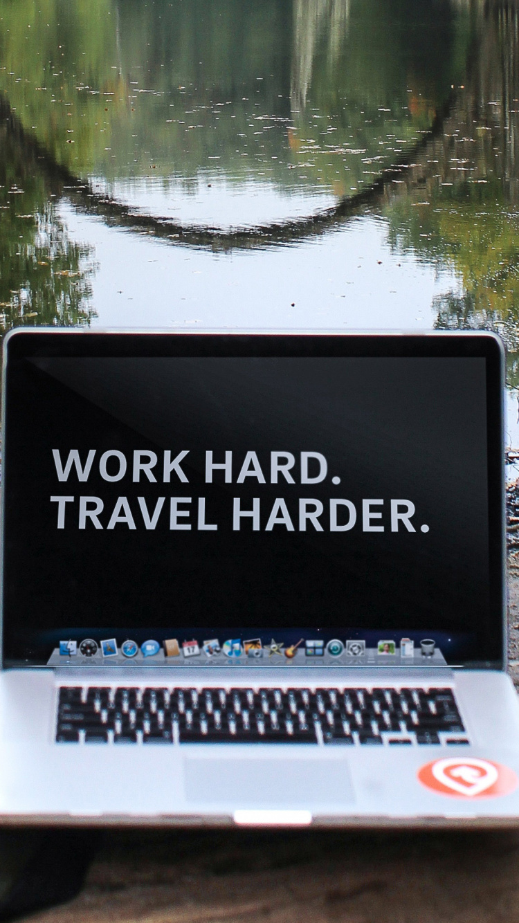 Macbook Pro on Brown Rock Near Lake. Wallpaper in 750x1334 Resolution