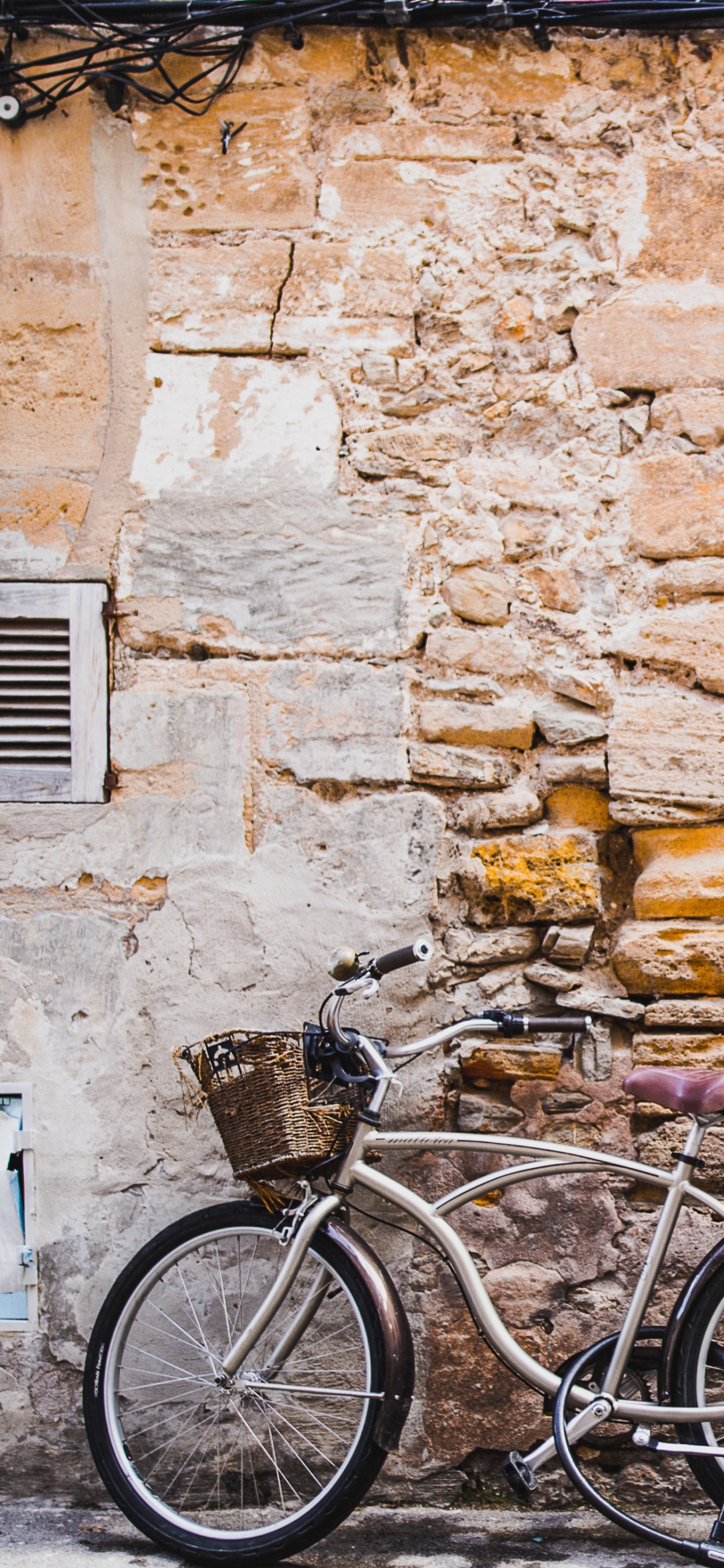 Black City Bike Beside Brown Brick Wall. Wallpaper in 1242x2688 Resolution