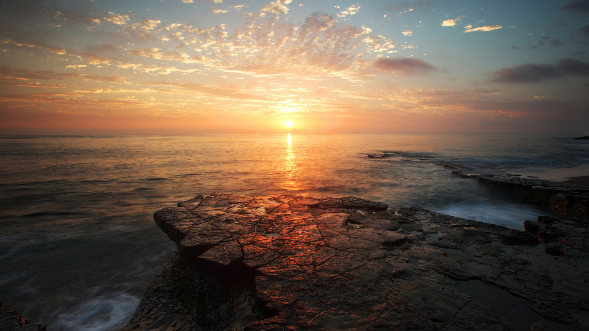 Rocky Shore During Sunset Under Blue Sky. Wallpaper in 1920x1080 Resolution