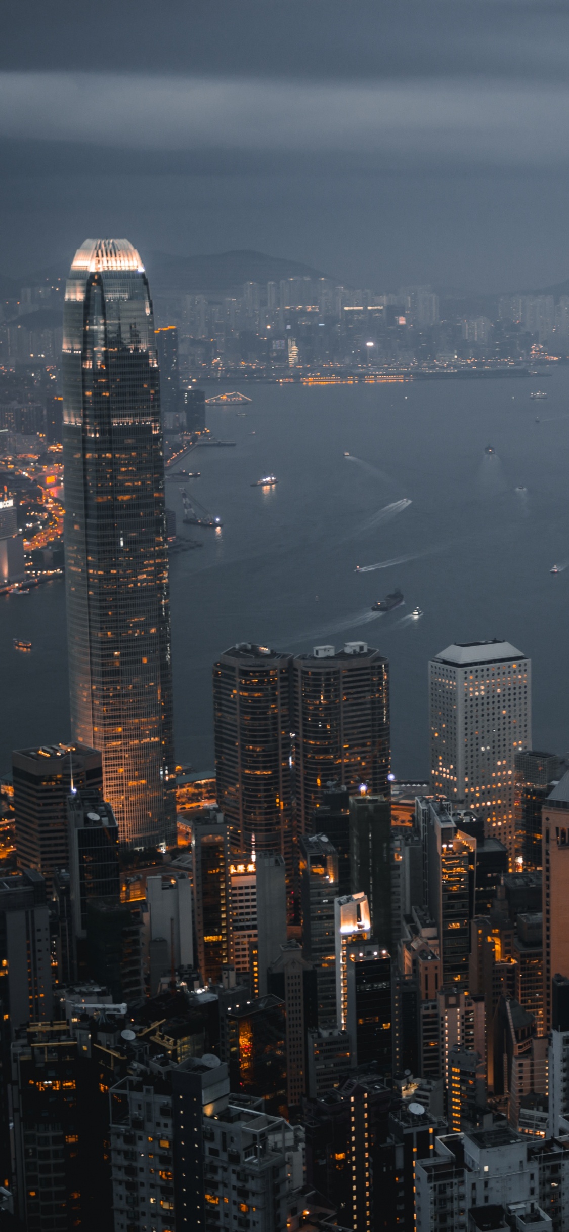 Aerial View of City Buildings During Night Time. Wallpaper in 1125x2436 Resolution