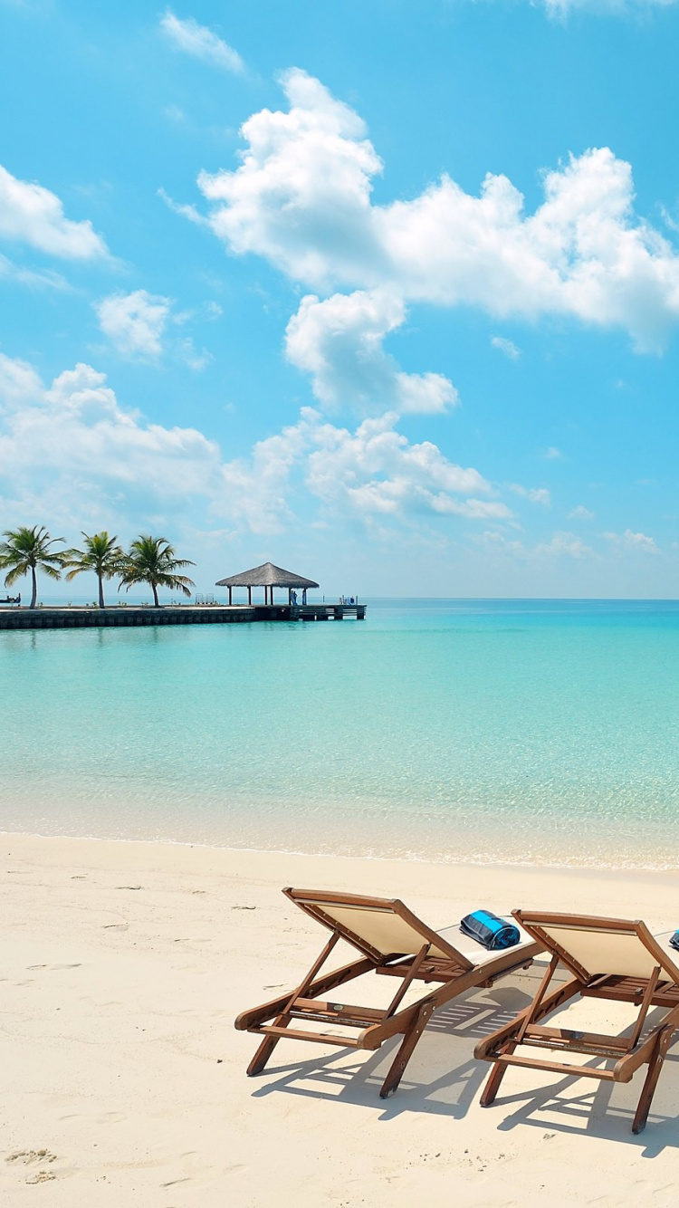Brown and White Lounge Chairs on Beach During Daytime. Wallpaper in 750x1334 Resolution