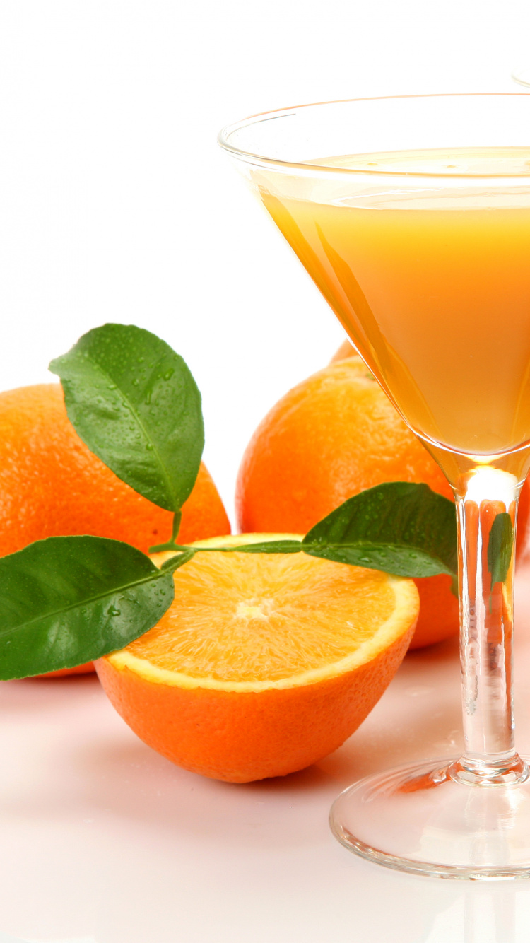 Jus D'orange Dans un Verre Transparent. Wallpaper in 750x1334 Resolution