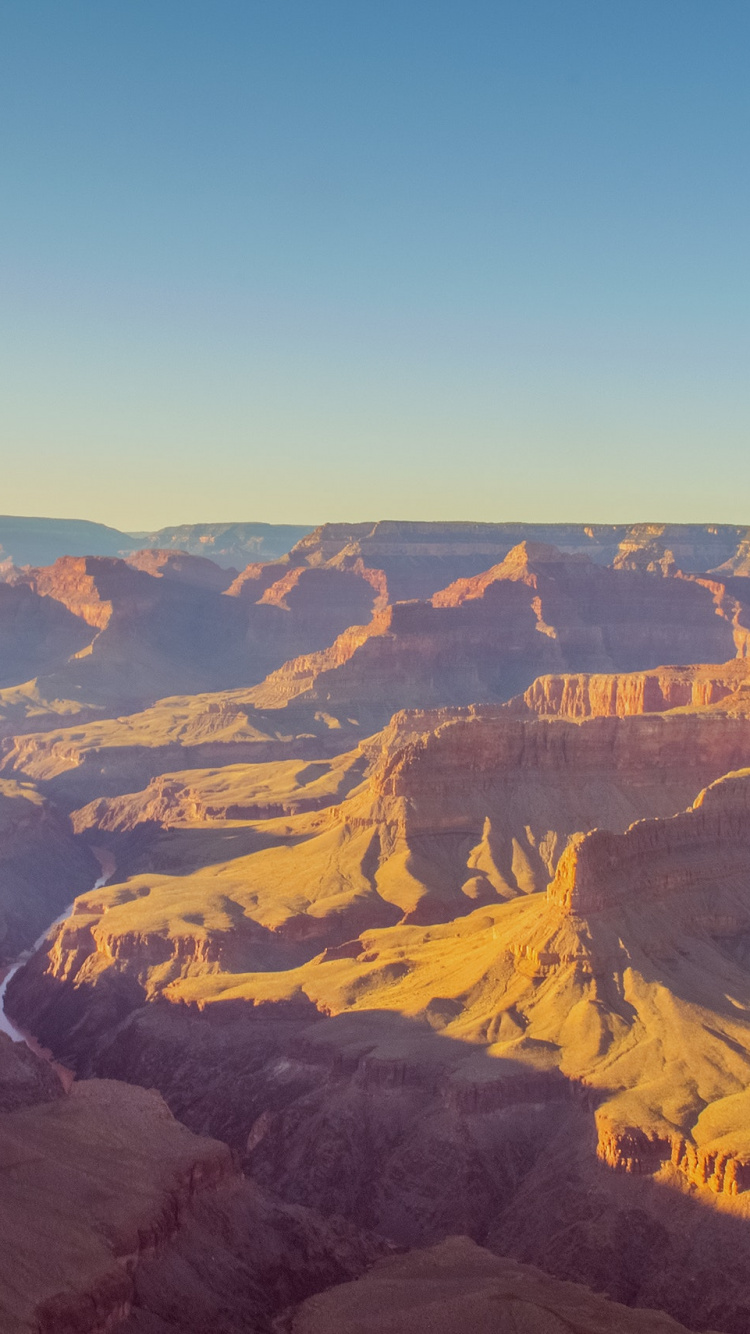Brown and Black Mountains Under Blue Sky During Daytime. Wallpaper in 750x1334 Resolution