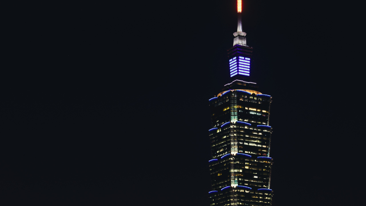 Black and Yellow High Rise Building During Night Time. Wallpaper in 1280x720 Resolution