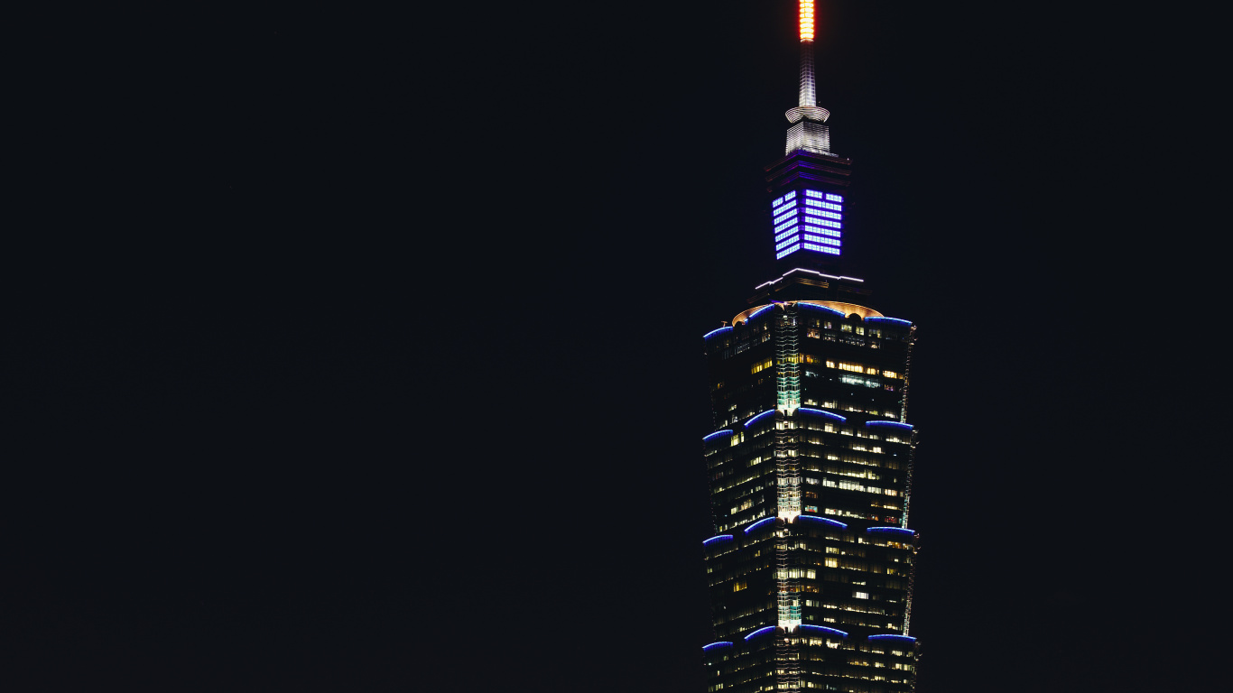 Black and Yellow High Rise Building During Night Time. Wallpaper in 1366x768 Resolution