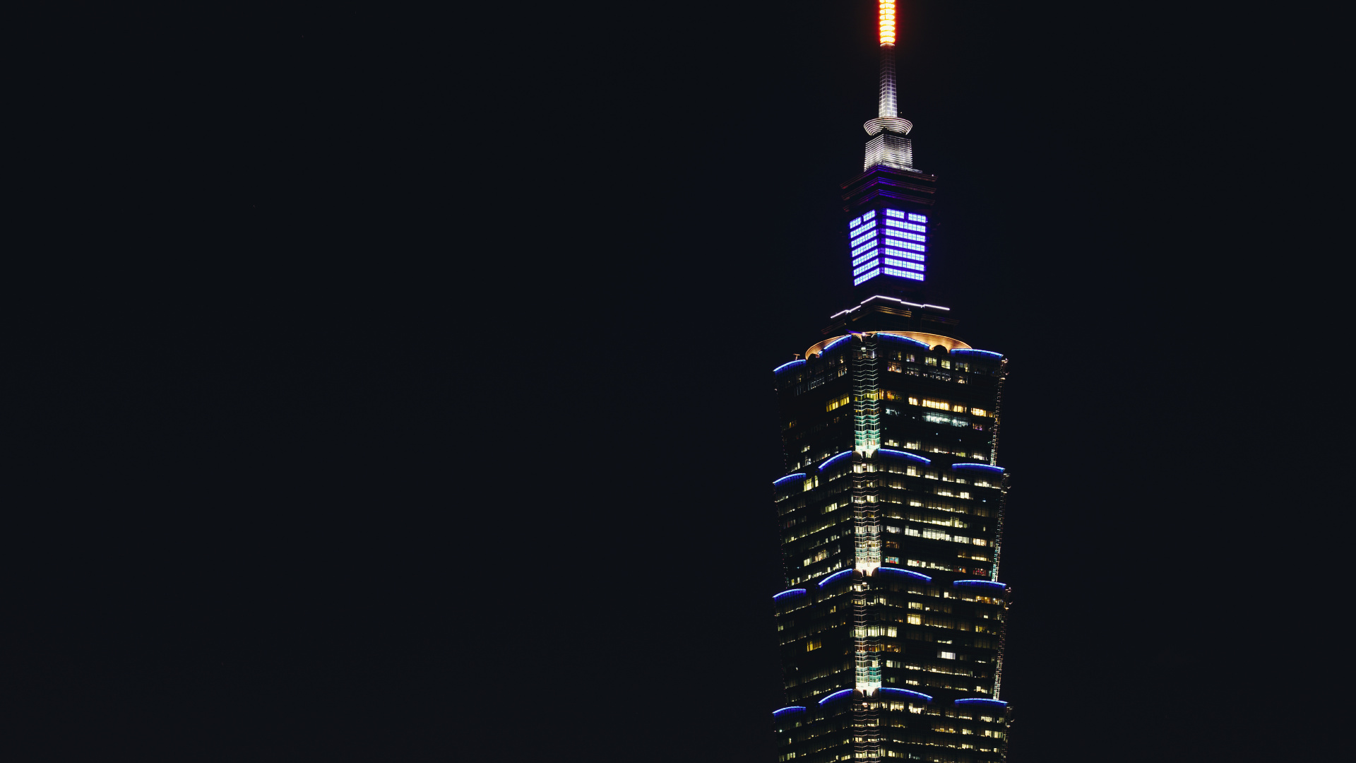 Black and Yellow High Rise Building During Night Time. Wallpaper in 1920x1080 Resolution