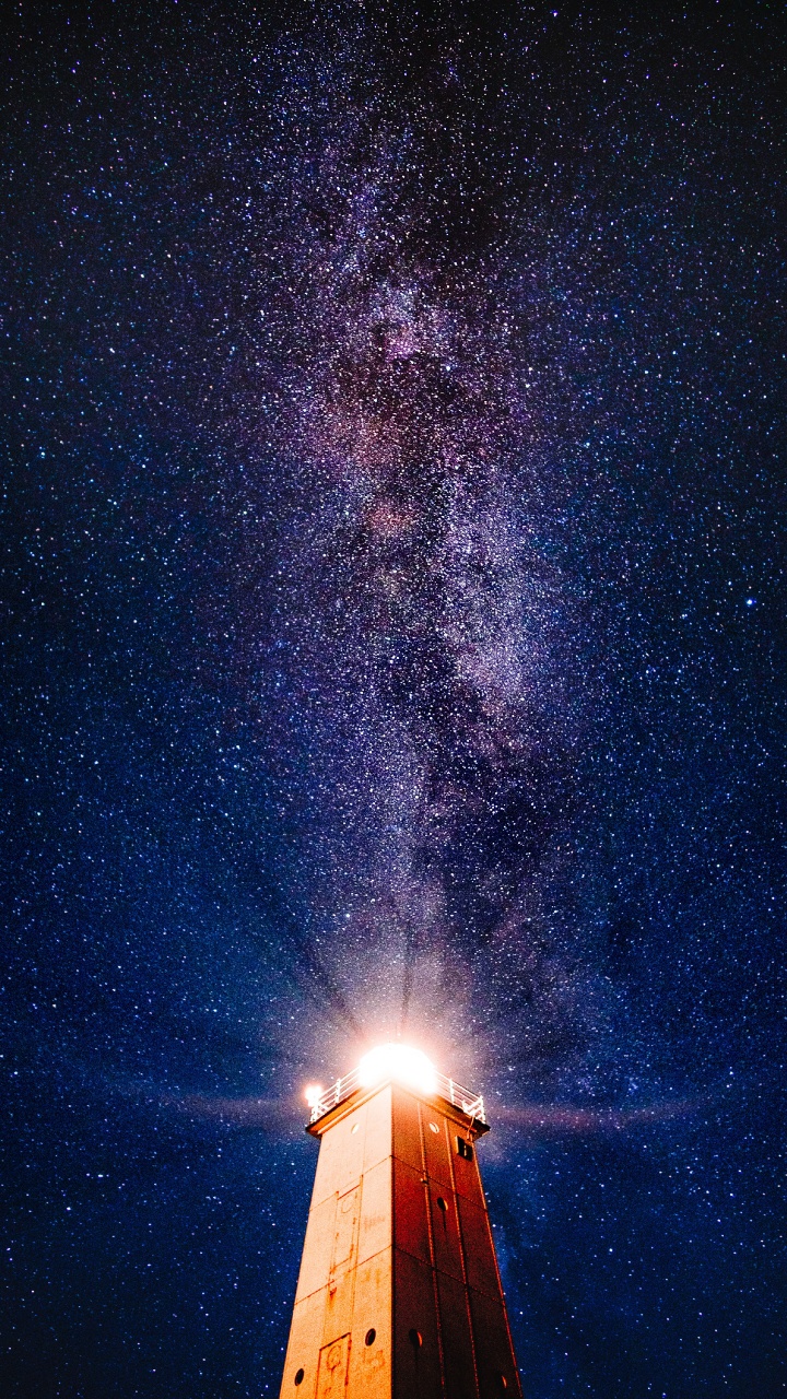 Brown Wooden House Under Starry Night. Wallpaper in 720x1280 Resolution