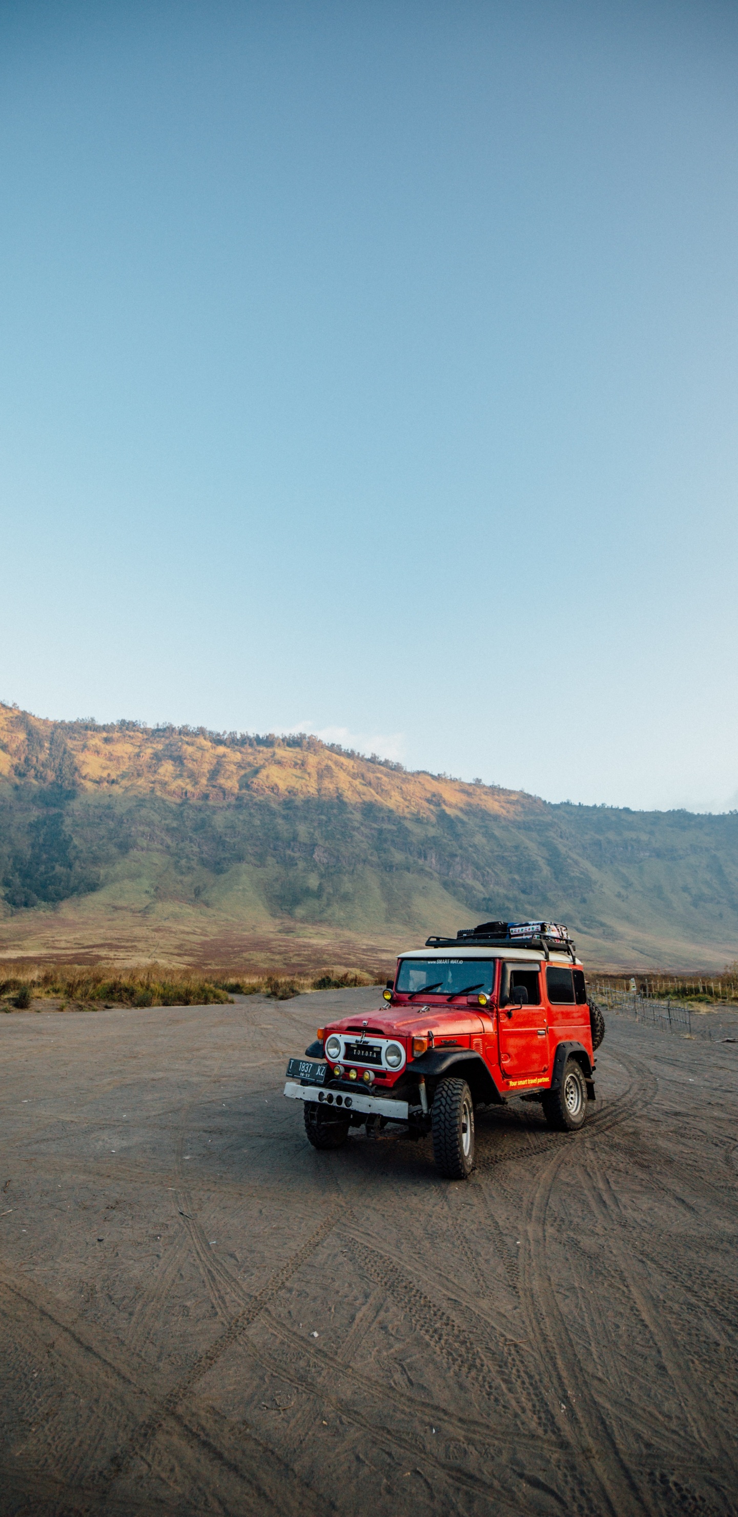 Red Suv on Brown Field During Daytime. Wallpaper in 1440x2960 Resolution