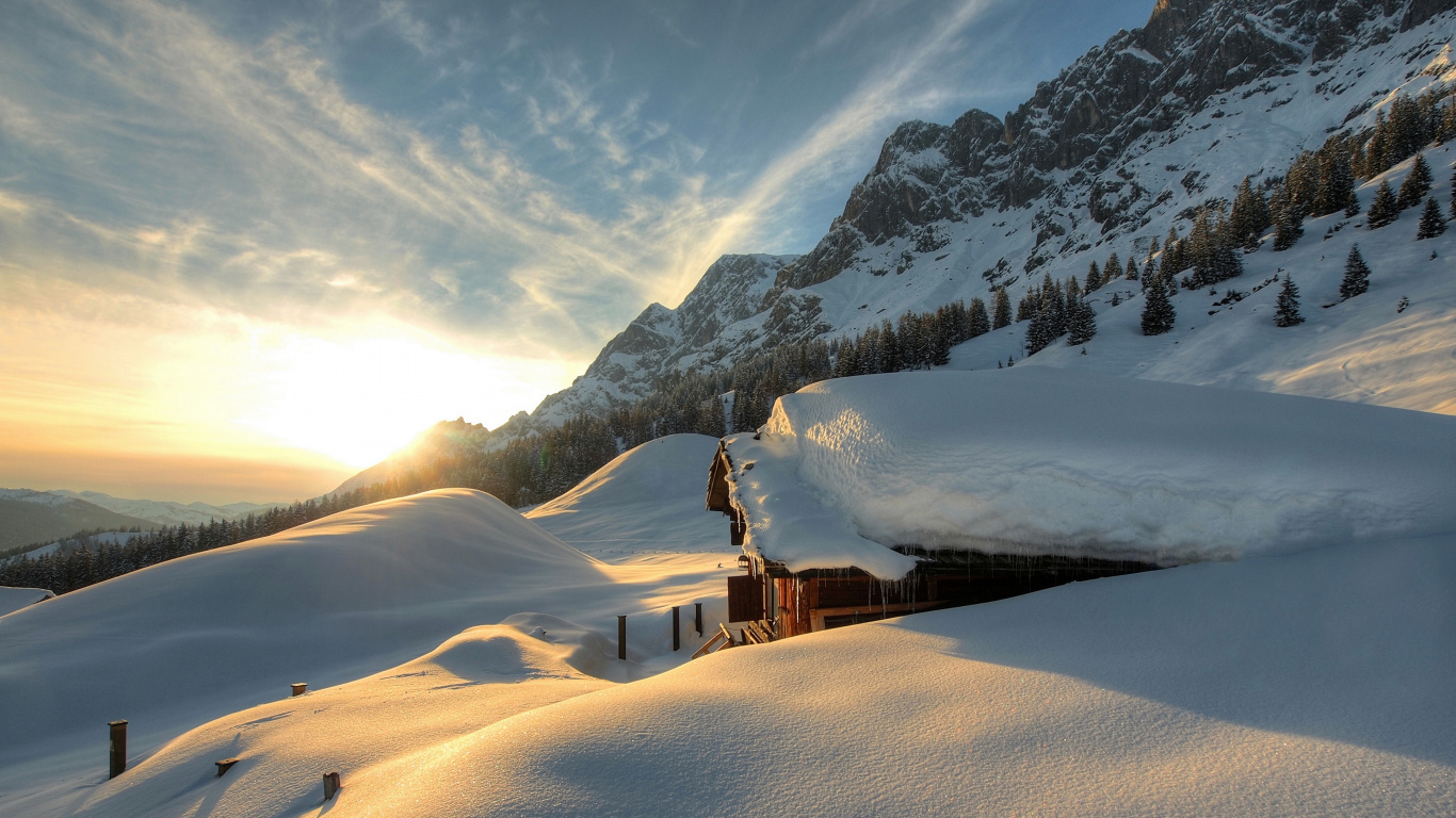 Brown Wooden House on Snow Covered Mountain During Daytime. Wallpaper in 1366x768 Resolution