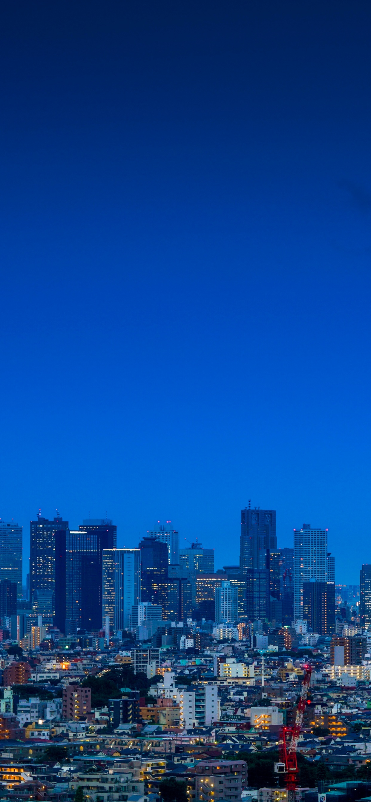 City With High Rise Buildings Under Blue Sky During Daytime. Wallpaper in 1242x2688 Resolution
