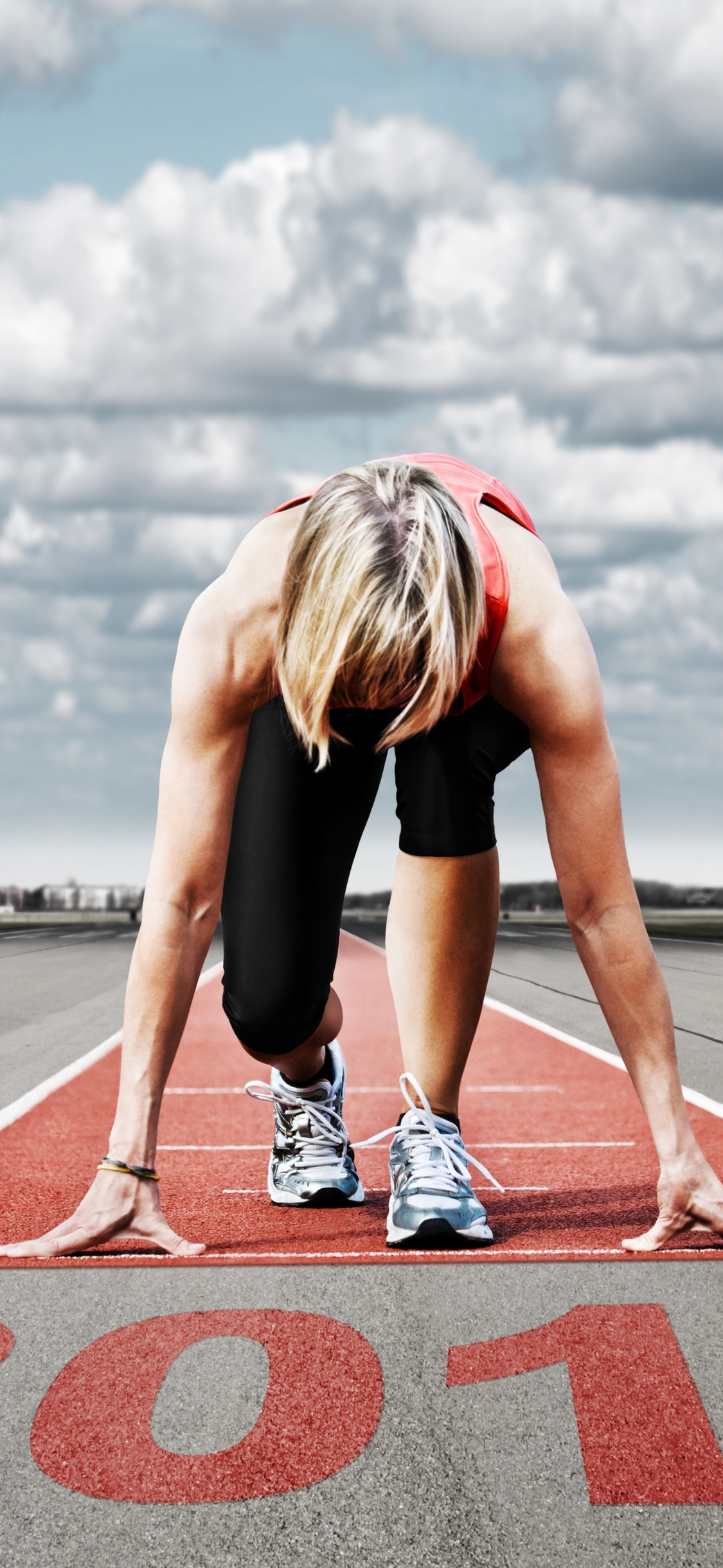 Woman in Black Tank Top and Black Shorts Doing Push up on Gray Concrete Road During. Wallpaper in 1125x2436 Resolution