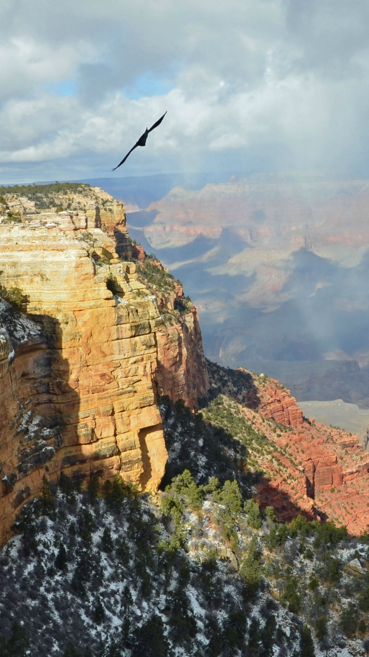 Montaña Rocosa Marrón Bajo Nubes Blancas Durante el Día. Wallpaper in 750x1334 Resolution