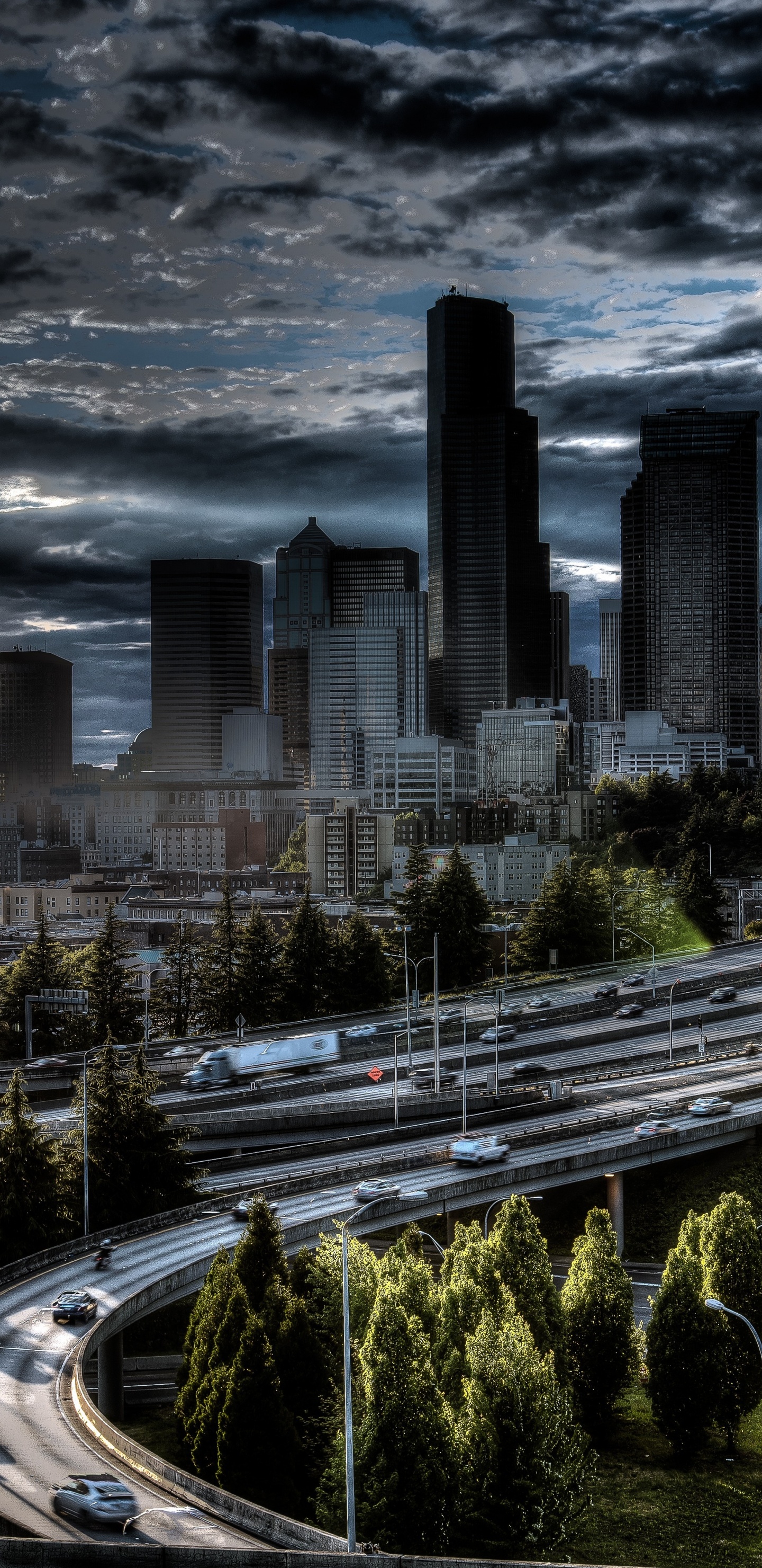 City Buildings Under Gray Clouds During Daytime. Wallpaper in 1440x2960 Resolution