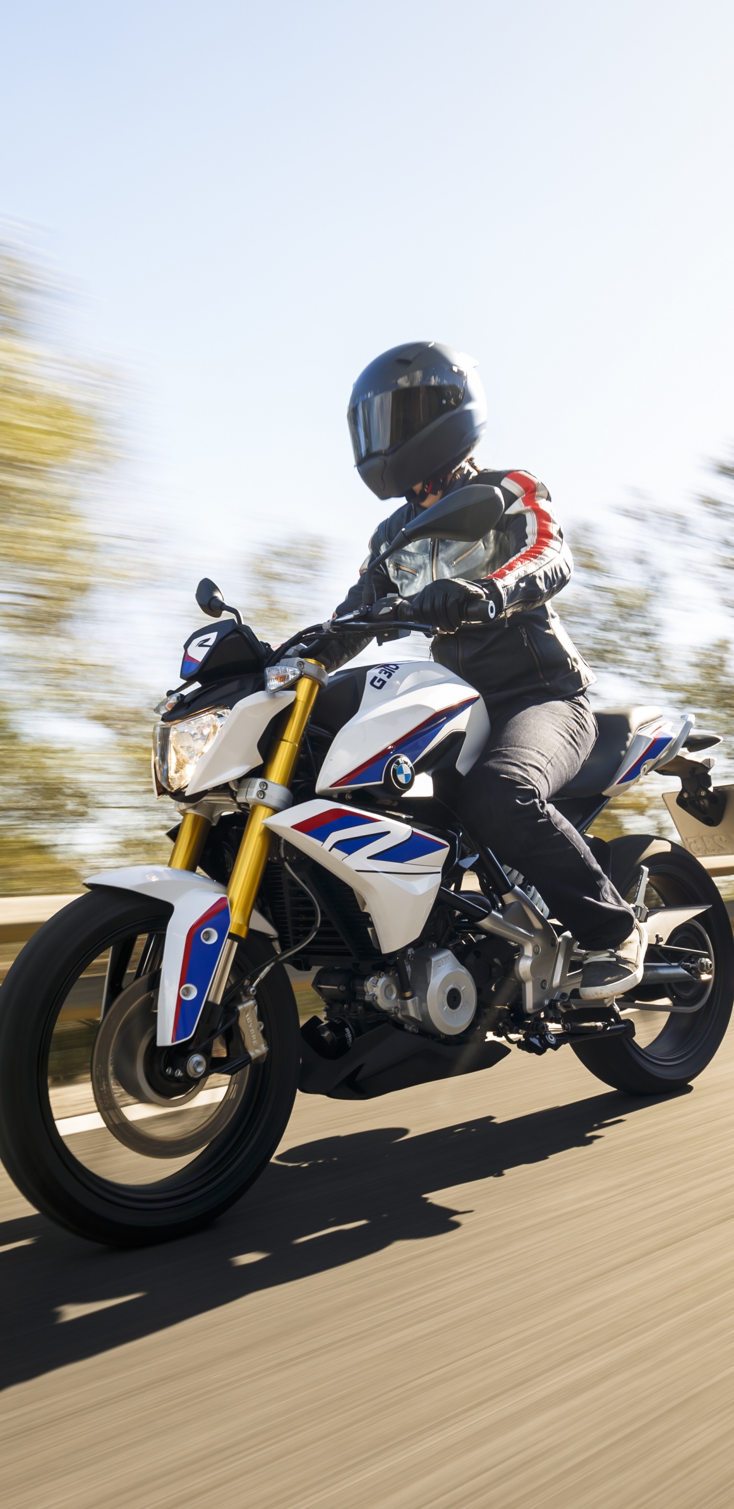 Man in Black Jacket Riding Motorcycle on Road During Daytime. Wallpaper in 1440x2960 Resolution