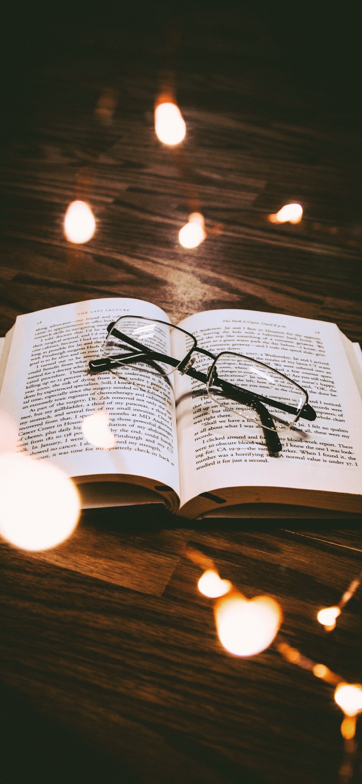 Black Framed Eyeglasses on White Book Page. Wallpaper in 1242x2688 Resolution
