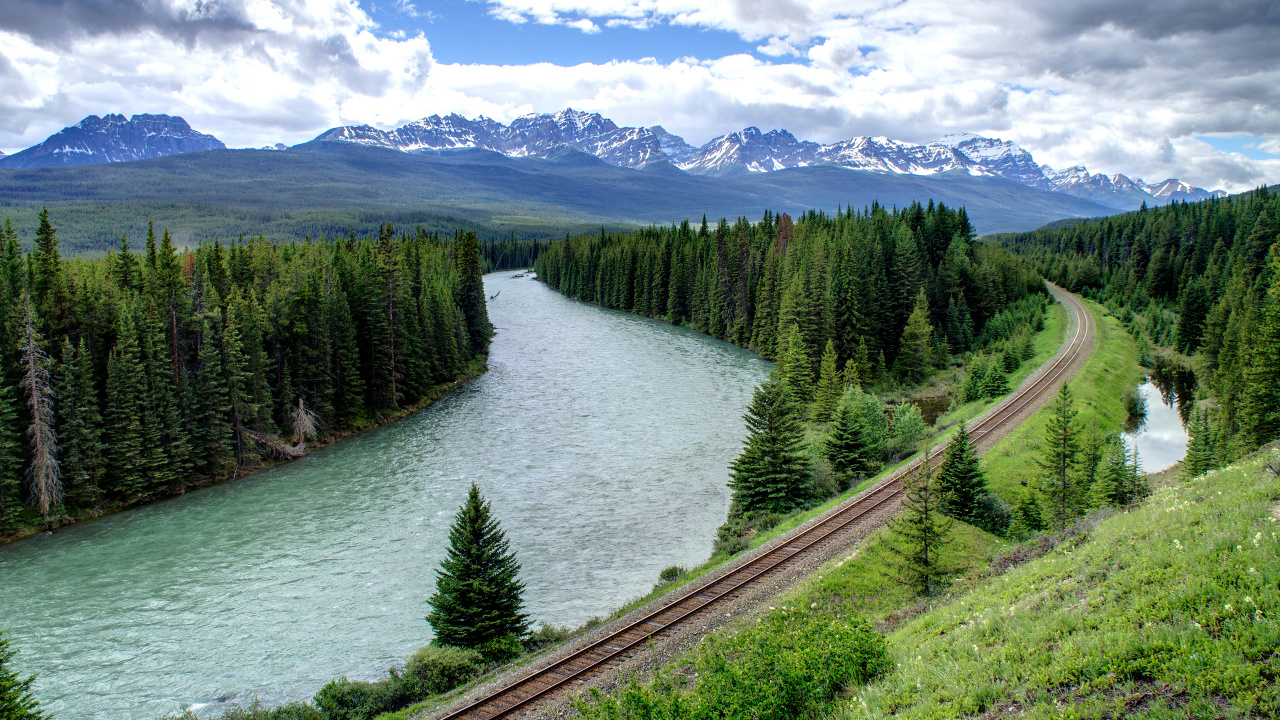 Green Pine Trees Near River Under White Clouds and Blue Sky During Daytime. Wallpaper in 1280x720 Resolution