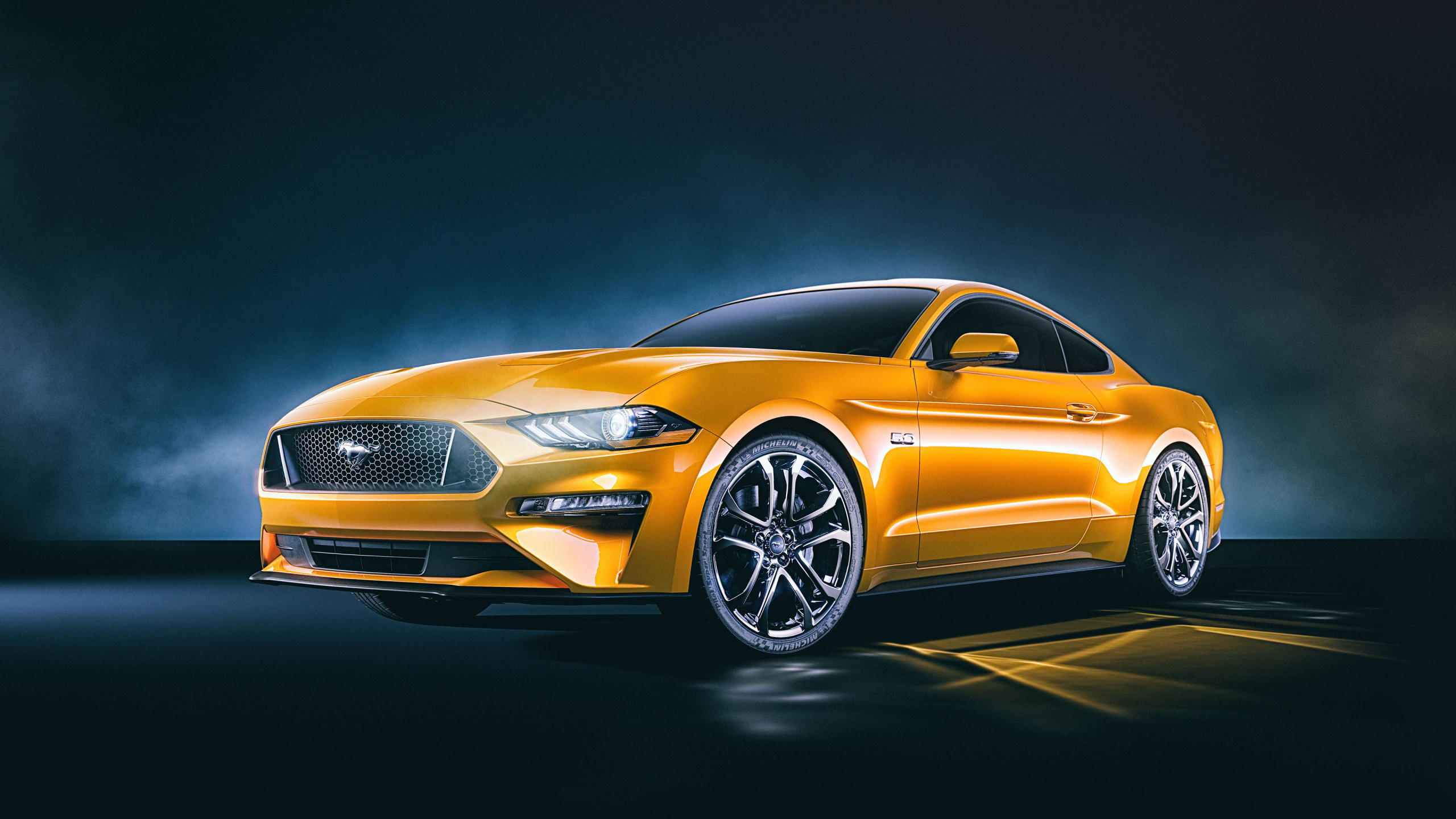 Gold Mercedes Benz Coupe on Black Background. Wallpaper in 2560x1440 Resolution