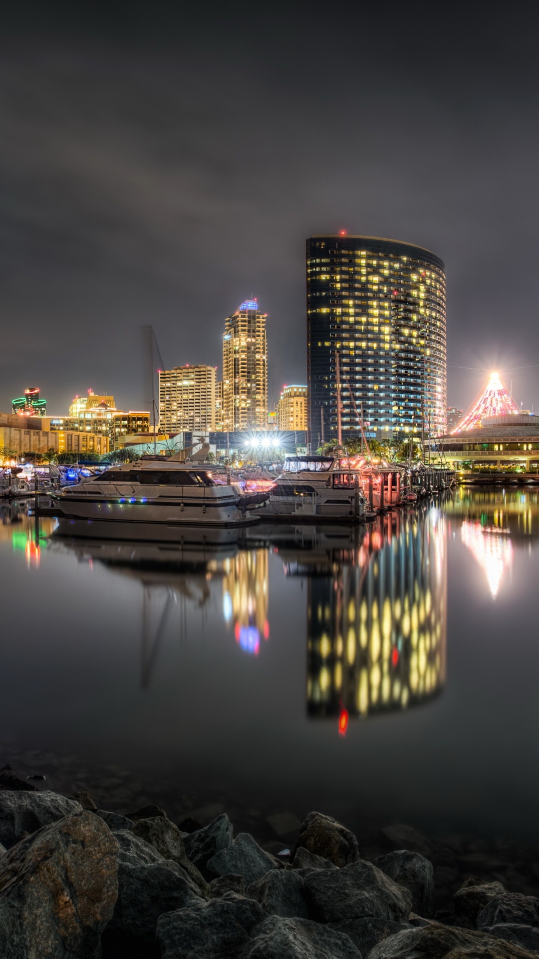 City Skyline Across Body of Water During Night Time. Wallpaper in 1080x1920 Resolution