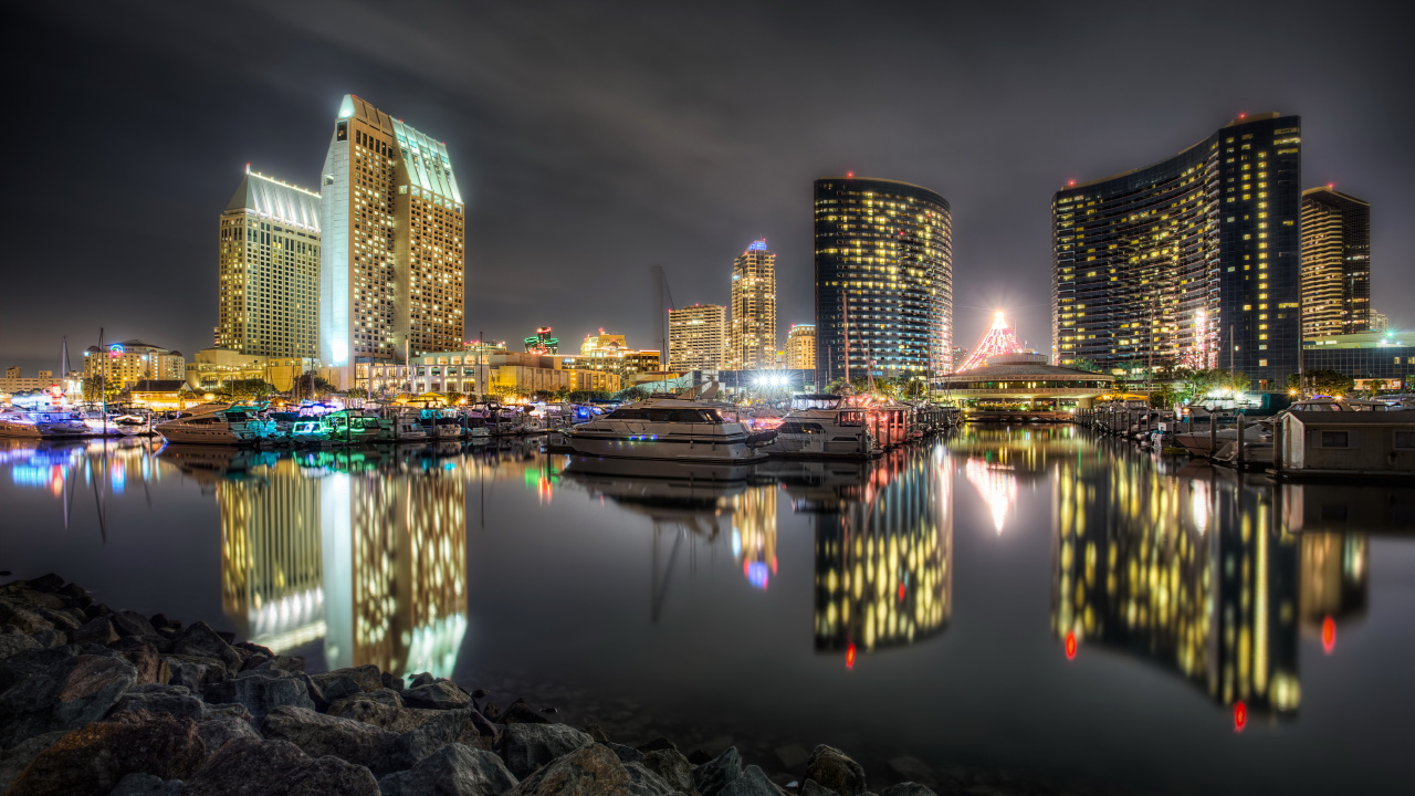 City Skyline Across Body of Water During Night Time. Wallpaper in 1280x720 Resolution