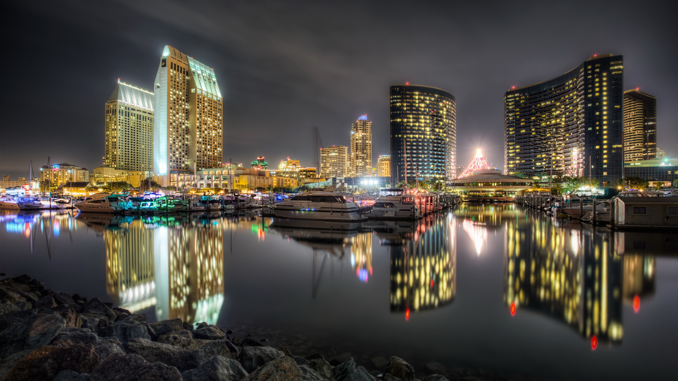 City Skyline Across Body of Water During Night Time. Wallpaper in 1366x768 Resolution