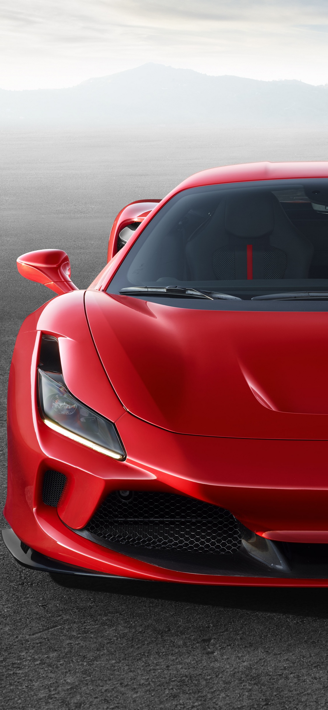 Red Ferrari Sports Car on Gray Asphalt Road During Daytime. Wallpaper in 1125x2436 Resolution