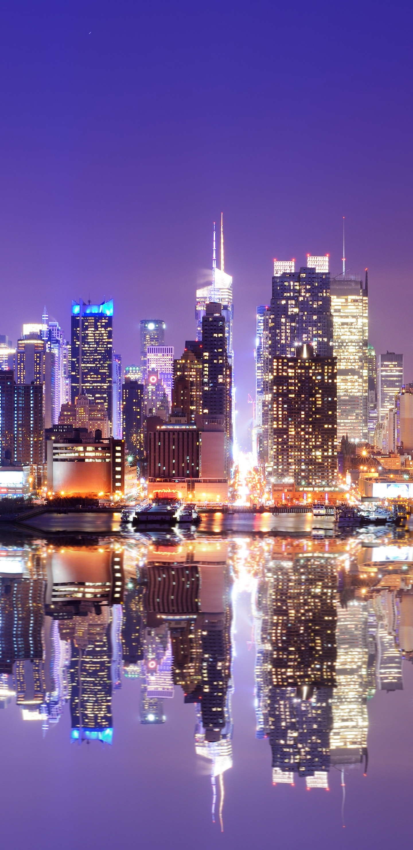 City Skyline Across Body of Water During Night Time. Wallpaper in 1440x2960 Resolution