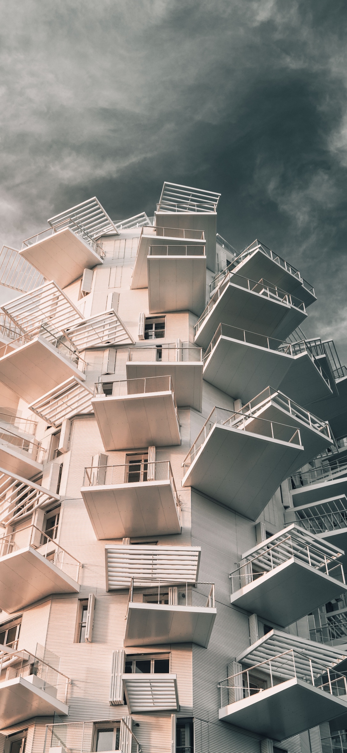 White Concrete Building Under Cloudy Sky During Daytime. Wallpaper in 1125x2436 Resolution