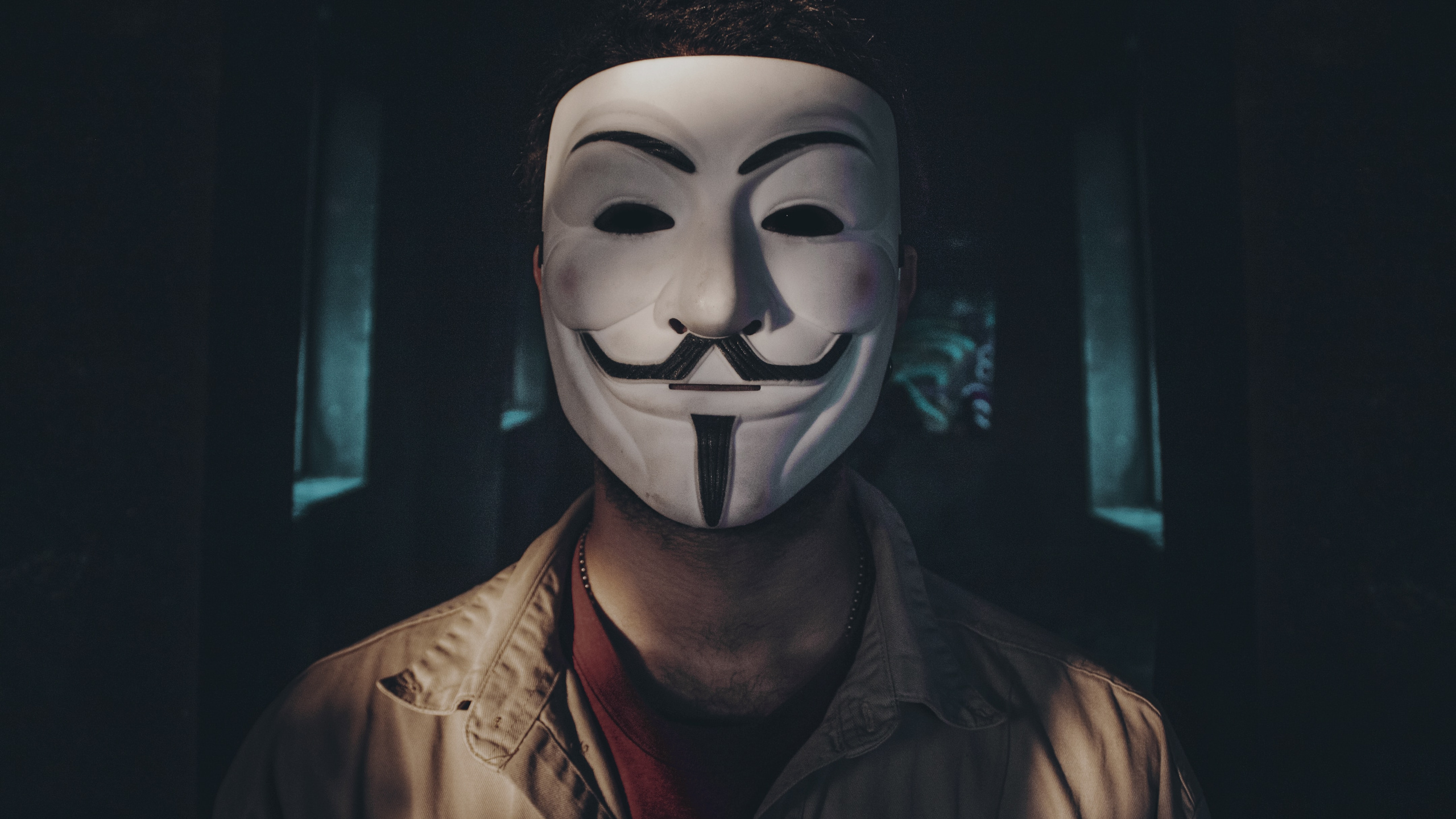 Man in Brown Leather Jacket Wearing White Mask. Wallpaper in 2560x1440 Resolution