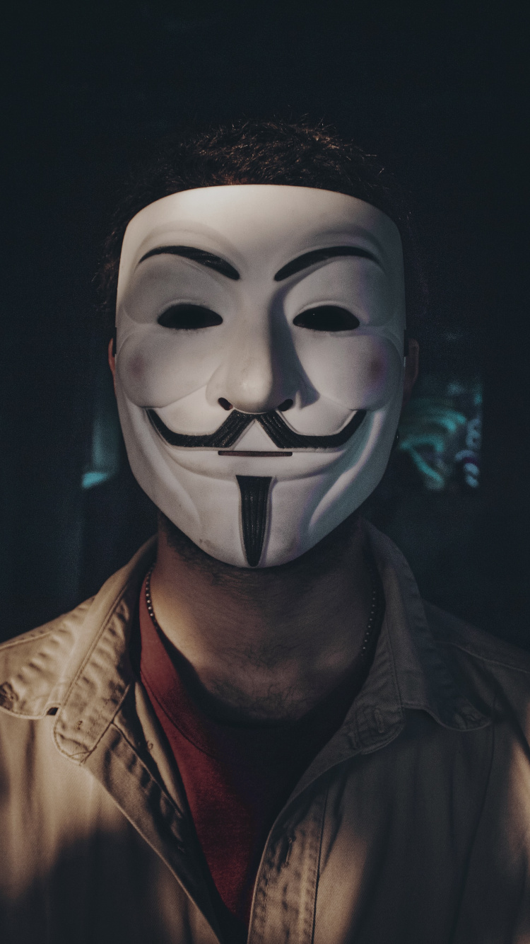 Man in Brown Leather Jacket Wearing White Mask. Wallpaper in 750x1334 Resolution