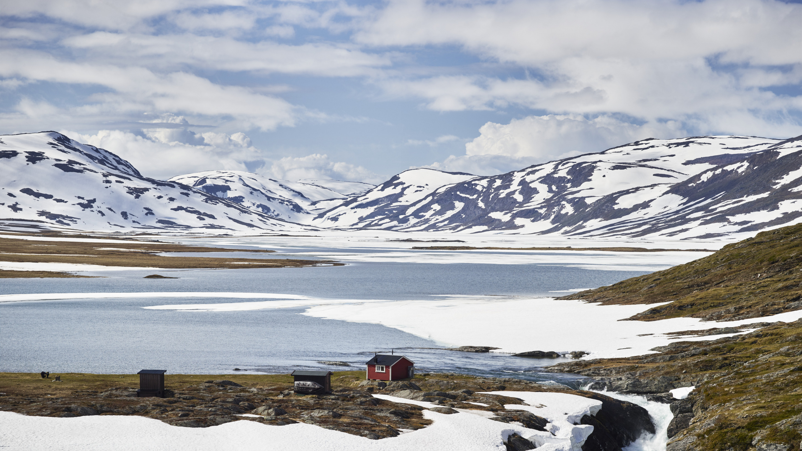 Snow Covered Mountain Near Body of Water During Daytime. Wallpaper in 2560x1440 Resolution