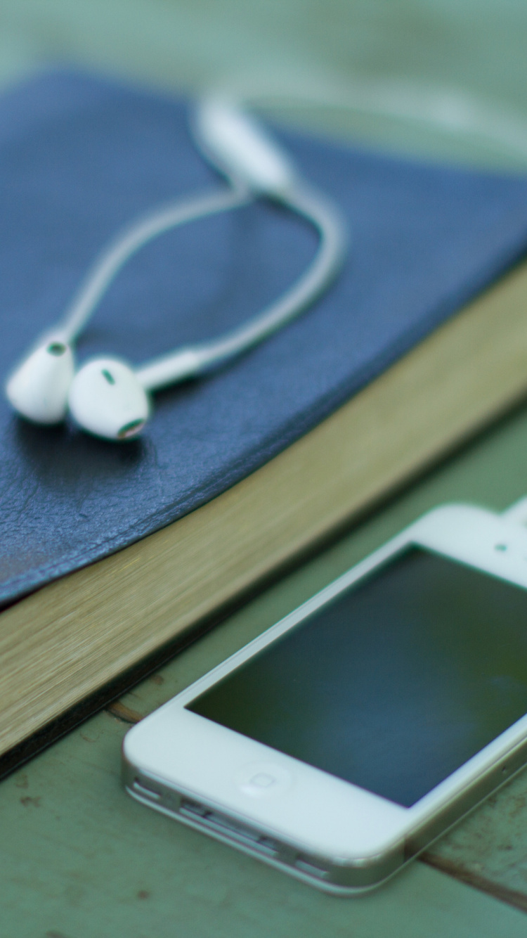 White Iphone 4 on Brown Wooden Table. Wallpaper in 750x1334 Resolution
