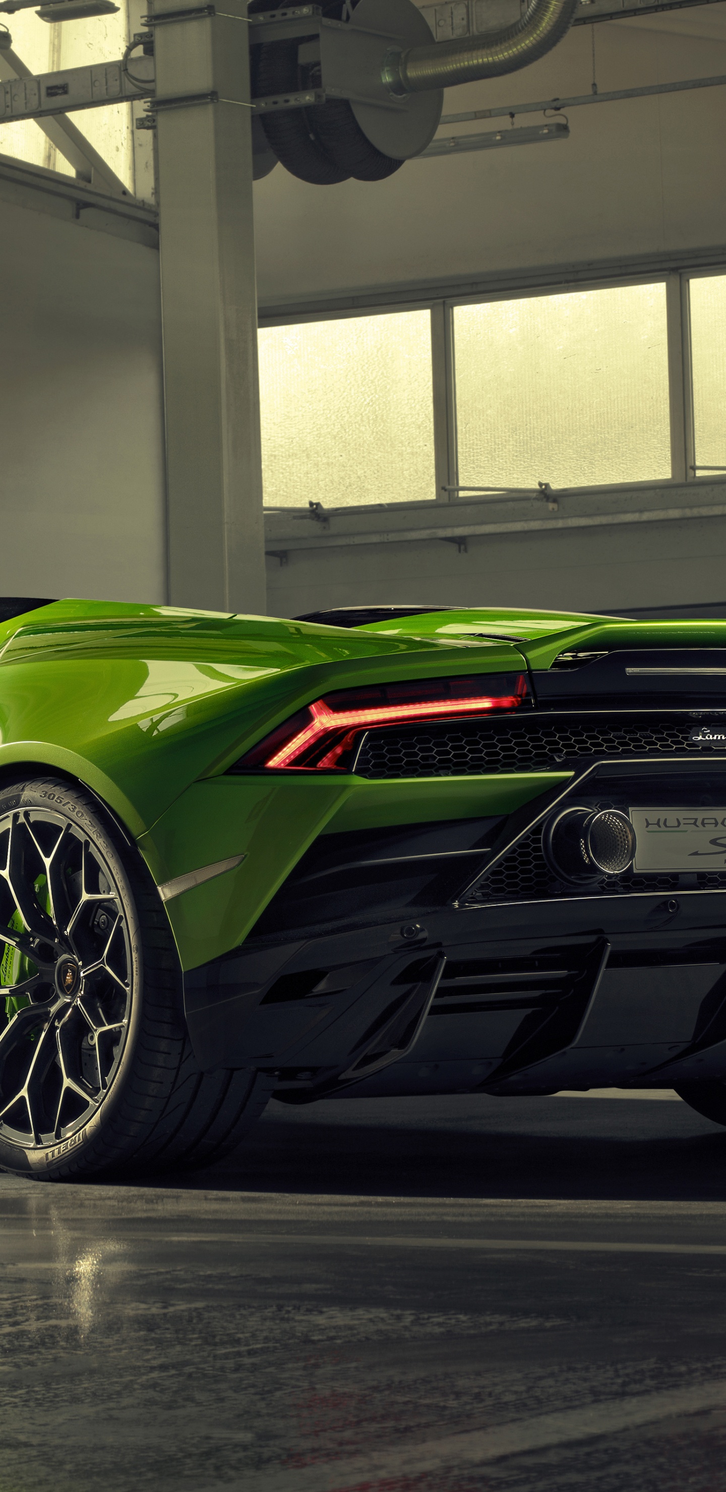 Green Porsche 911 Parked in Building. Wallpaper in 1440x2960 Resolution