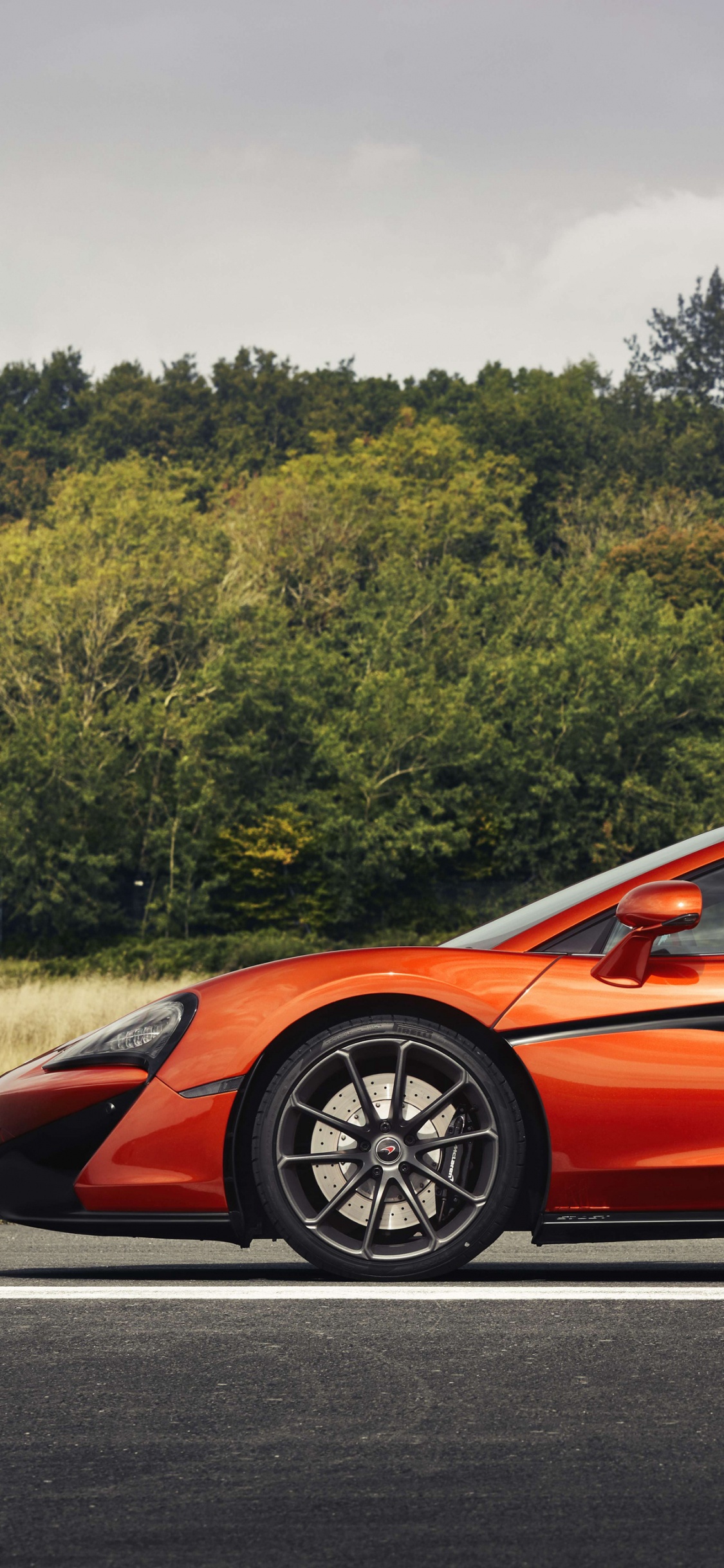Red Ferrari 458 Italia on Road During Daytime. Wallpaper in 1125x2436 Resolution